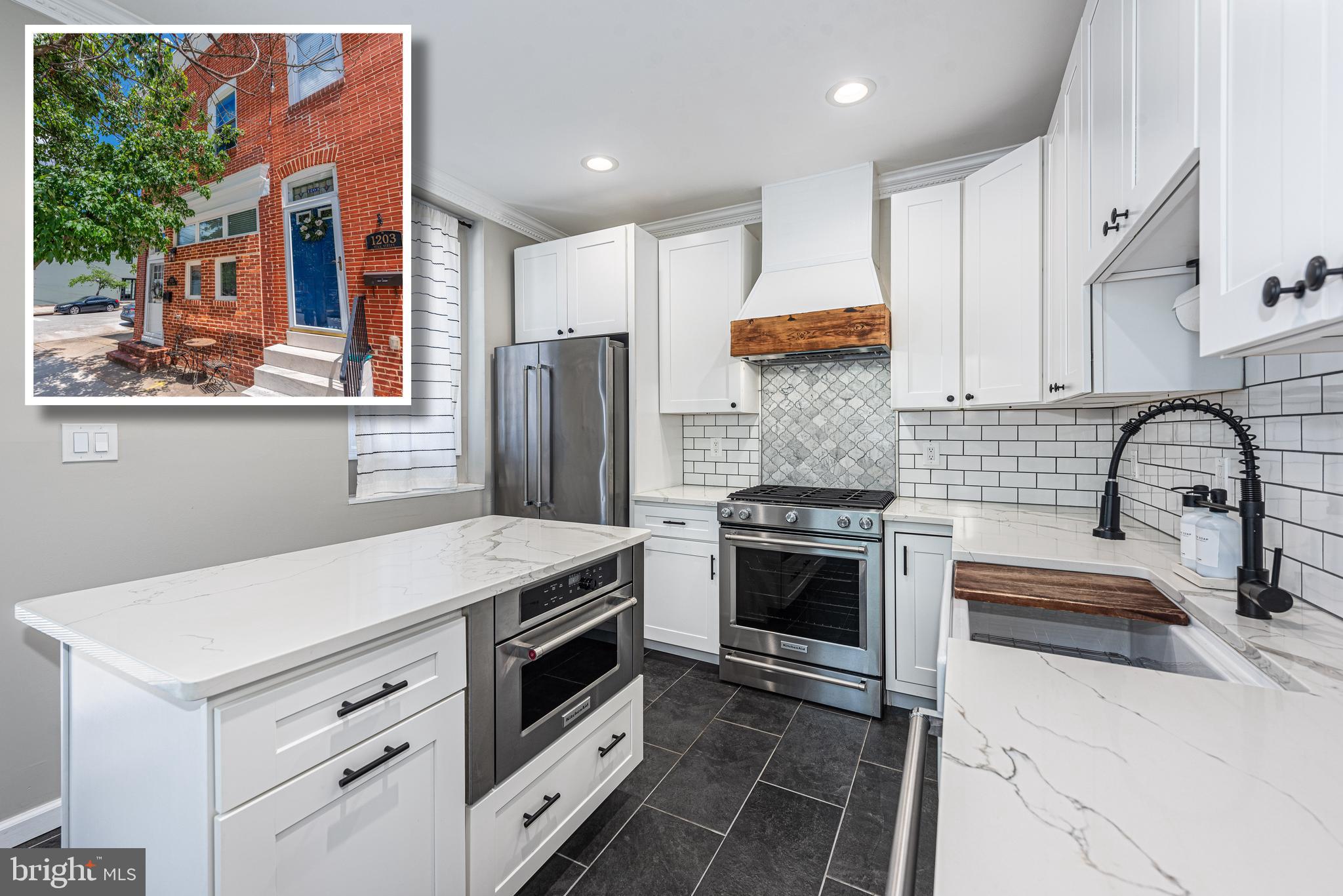 BEYOND SPECTACULAR END OF GROUP RENOVATION WITH A ROOFTOP DECK AND OFF STREET PARKING!  Welcome to your dream home!  This home perfectly blends modern luxury and thoughtful design and features 11 ft. ceilings, hardwood floors, and exposed brick throughout, a designer island kitchen with a large island, Quartz counters, and a premium Kitchen Aid appliance package, a convenient main level half bath, upper level with 2 bedroom suites including a Primary bedroom suite with a luxury bath featuring a walk-in glass enclosed shower, double vanity, and heated floors, bedroom level laundry with new LG washer and dryer, a finished basement with 2 additional bedrooms and a full bath with heated floors, a 2nd level rear deck which leads to the rooftop deck with sweeping views of the Harbor, Domino Sugar sign, & Silo Point, and convenient off street parking!  There are thoughtful details throughout this home including smart lighting throughout, energy certification through BGE, all new windows, a custom coffee/dry bar with a wine fridge, and a new roof and rooftop deck.  Convenient location - close to restaurants, shopping, and a quick commute to major roadways.  This is city living at it's best!