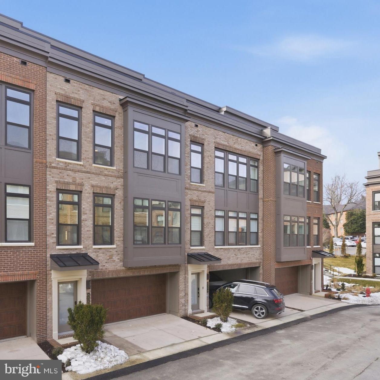 This newly constructed four-level townhome offers over 3200 square feet of interior living space in the Westbard Square community. A key feature of this residence is the private elevator that services all four floors, ensuring complete accessibility from the garage to the loft. The home is built with a modern all-electric design for energy efficiency and includes an attached, oversized two-car garage pre-wired with electric vehicle charging capabilities.

The home includes four bedrooms and four-and-a-half bathrooms, anchored by an open-concept main living level with 9-foot ceilings and wide-plank hardwood flooring. The kitchen features shaker-style cabinetry, a large center island with quartz countertops, and premium stainless steel appliances. The layout prioritizes versatility, featuring an entry-level flex room with a full en-suite bath suitable for a home office or guest quarters. The primary suite on the upper level includes dual walk-in closets and a bathroom with a frameless glass shower and dual vanities.

Outdoor and entertainment spaces are integrated throughout the design, highlighted by a private rooftop terrace on the fourth level and a separate rear deck off the main living area. The loft level adjacent to the terrace includes a wet bar and beverage fridge and is pre-wired for audio/visual needs, including Sonos speakers. It is the perfect indoor / outdoor entertainment space.

Positioned for high walkability, the property is located within 100 feet of the Westbard Square central plaza. This location provides immediate pedestrian access to Giant Food, Starbucks, Tatte Bakery & Café, Oak Barrel & Vine, and Silver and Sons BBQ. The community offers landscaped green spaces and children's play areas.  Monthly HOA fees cover common area maintenance, lawn care, and snow removal.