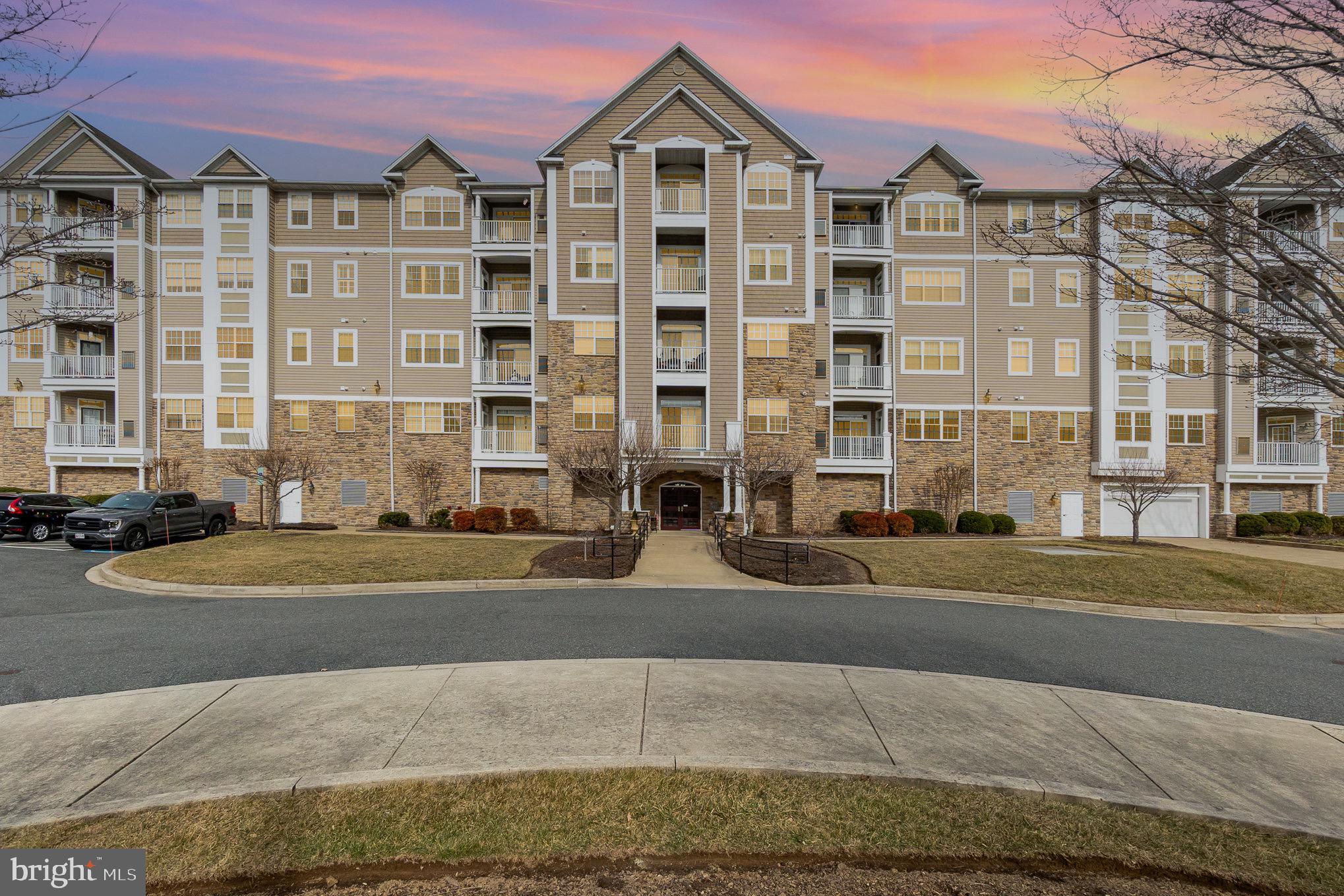 Welcome to this modern 55+ community just outside of the town of Bel Air in a serene and secluded setting.  These units were just built in 2017 and come with a parking space in the attached parking garage.  Once inside take the elevator to the second floor to find the unit.  The condo itself is modern with quality finishes such as hard wood flooring throughout, 9 ft ceilings, modern baths and a kitchen with granite countertops, breakfast bar, backsplash and stainless appliances.  Off of the main living area is a balcony and a large bedroom and full bath off of each side of it.  There is also an en-suite laundry room with washer and dryer.  This home is pristine and move in ready and waiting for you!  Entire was just freshly painted as of 3/5!