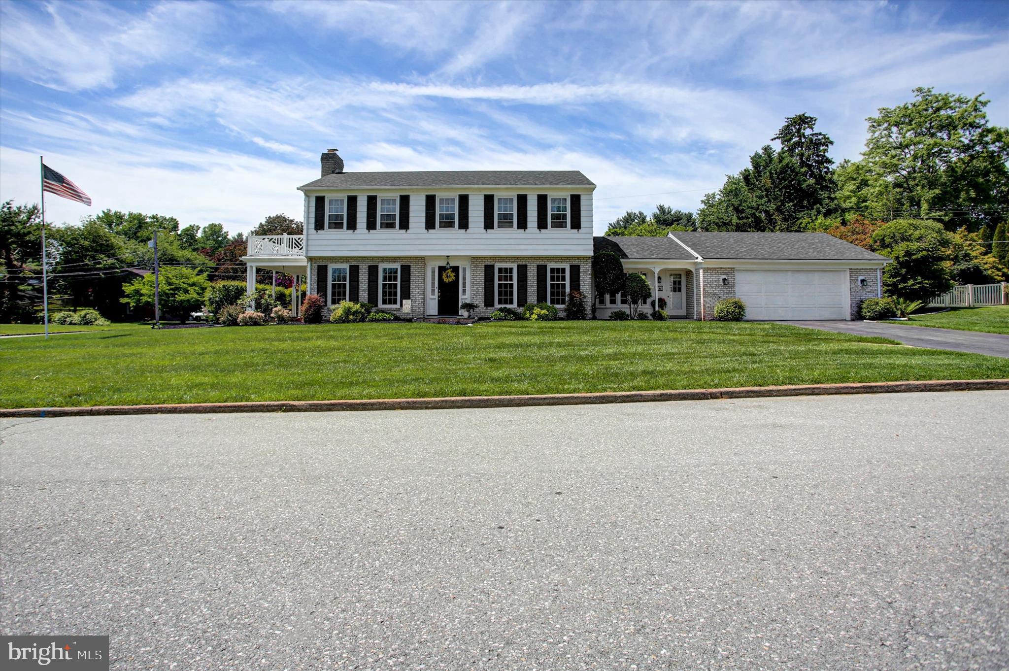 🏡✨ Welcome Home to Spring Valley! ✨🏡

Nestled on a beautiful corner lot in the highly desirable Spring Valley community, this meticulously maintained Colonial offers timeless charm, thoughtful updates, and exceptional living space inside and out!

Step inside and be greeted by gorgeous hardwood floors throughout, elegant crown molding, and classic chair rail detailing that create a warm and inviting atmosphere. The recently updated kitchen is sure to impress with granite countertops, ceramic tile flooring, a charming bay window, and all appliances conveying with the sale.

The sun-filled living room features abundant natural light, a cozy wood-burning fireplace, and direct access to the covered side porch—the perfect spot to relax and unwind while enjoying the outdoors. The spacious dining room easily accommodates family gatherings and holiday celebrations.

🚗 The oversized garage is a dream for hobbyists and organizers alike, featuring built-in shelving, a workbench, pull-down attic access, a brand-new garage door opener, plus an additional refrigerator and chest freezer that convey.

The main level full bath offers a convenient sunken tub/shower combination for easy entry and exit. Upstairs you'll find three generously sized bedrooms and a full bath. The primary suite includes a large walk-in closet, private sink vanity area, comfortable sitting/dressing space, and attic access to the air handler.

🔥 The finished lower level provides even more living space with a spacious family room featuring a second wood-burning fireplace, storage under the stairs, and plenty of room for entertaining. The utility room houses the oil hot water boiler with individual controls for each level, providing customized comfort throughout the home. A dedicated laundry room includes a double utility sink, shelving, and washer and dryer that convey. Additional storage areas and two adjoining rooms offer excellent options for a root cellar, workshop, hobby space, or seasonal storage.

🌳 Outside, you'll fall in love with the beautifully landscaped gardens and impeccably manicured yard. A recently installed split-rail fence (April 2026) enhances both curb appeal and functionality.

🔨 Major updates provide peace of mind, including:
✔️ New Roof (2025) with transferable warranty
✔️ All new Window World windows
✔️ HVAC system with heat pump
✔️ Water heater installed in 2024
✔️ Furnace professionally serviced annually by Hardell
✔️ Quarterly Ehrlich Pest Service with 36 transponders installed around the property

Additional Features: The property is equipped with an in-ground lawn sprinkler system, an electric pet containment (dog fence) system, and a home security alarm system. These features were present when the current owners purchased the home; however, the sellers have never utilized the sprinkler or pet containment systems and make no representations regarding their current operation. The security system is currently disabled and will require activation and monitoring service by the buyer's preferred security company.  Buy with confidence—this home comes with a complimentary home warranty provided by the sellers.

This lovingly cared-for home offers the perfect combination of character, comfort, and modern updates. Don't miss this incredible opportunity to own a truly special home in Spring Valley! 🏡❤️