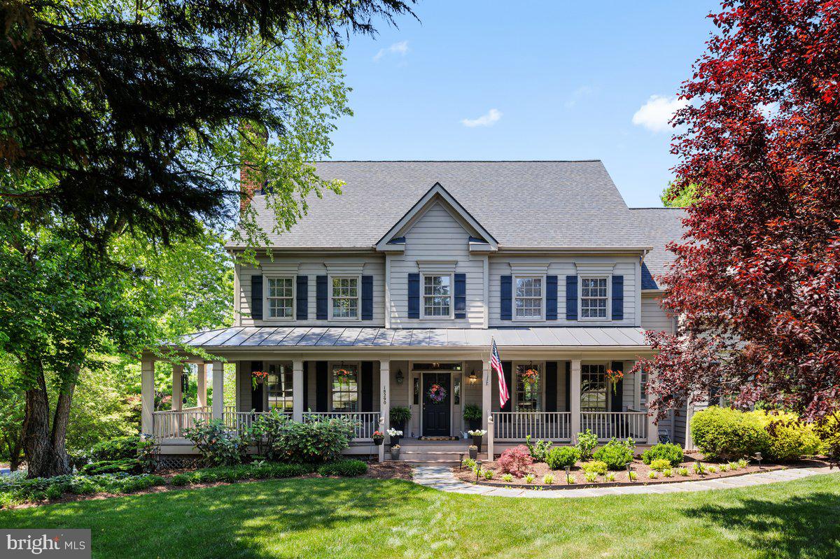Price improved and set on 1.5 acres in the Stoneleigh community of Round Hill, this updated home sits along the third hole of the golf course, with western mountain views carried throughout much of the home. The property combines open sightlines, mature trees, and professionally maintained landscaping with a layout that flows comfortably from one space to the next.

From the moment you arrive, the home’s classic exterior, expansive driveway, and inviting wraparound front porch create a strong first impression, complemented by a metal porch roof (2024), architectural roof (2022), and Craftsman-style exterior shutters (2022). A three-car garage offers space for storage, hobbies, or equipment.

Inside, hardwood floors run throughout the main level. The kitchen connects directly to the living area, anchored by two-story windows fitted with custom shades (2023) that bring in natural light and frame the surrounding mountainscape. A dedicated office on the main level offers a quiet workspace, and the three-season sunroom provides an easy transition to the outdoors. A newly built Trex deck (2025) extends the living space further, with added lighting for evening use.

Upstairs are four well-sized bedrooms. Two share a Jack and Jill bath, with an additional hall bath nearby. The huge primary suite features a vaulted ceiling, multiple walk-in closets and a fully renovated bathroom (2025) with freestanding soaking tub, dual vanities, and a walk-in shower.

Additional updates include dual HVAC systems (2024 and 2025), high-efficiency basement insulation (2026), kitchen appliances, lighting, carpeting, and various interior improvements.

Stoneleigh offers open green space, a golf course setting, and optional club membership with access to golf, clubhouse dining, and community events.