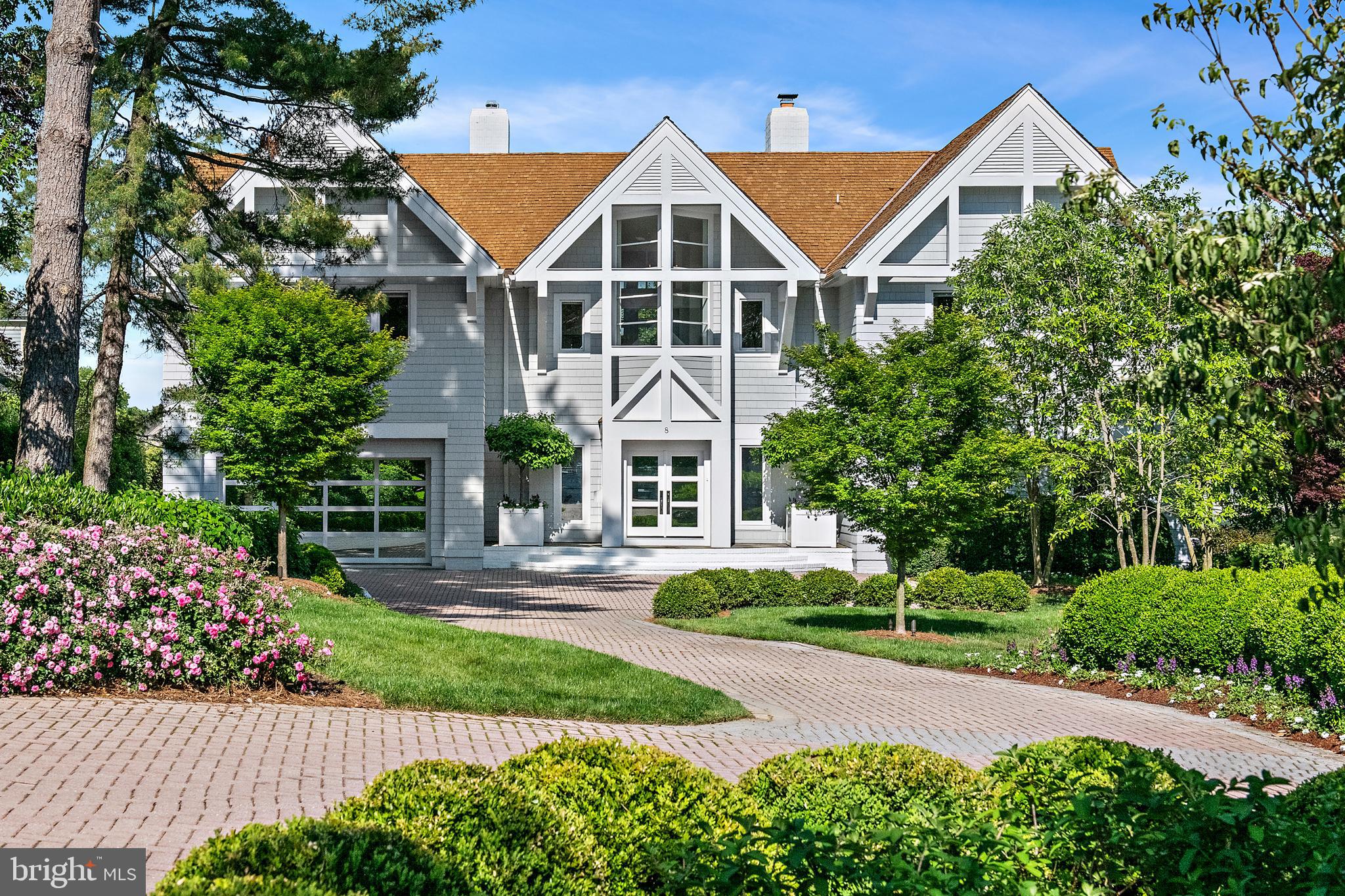 Absolutely one of the finest waterfront offerings in the City of Annapolis. Ideally situated on Spa Creek, this exceptional property boasts sweeping water views and showcases the Annapolis skyline, creating a waterfront lifestyle with a myriad of opportunities for boating, kayaking, and entertaining. Enjoy direct water access with the ability to travel by boat to City Dock, local restaurants, and ice cream destinations—an unmatched Annapolis waterfront lifestyle. A prime vantage point for the Blue Angels, fireworks, and the annual boat parade further confirms the setting.
Set within an exclusive, private enclave of three prominent homes, the residence features a waterside heated saltwater pool, deep-water pier, and a spacious Ipe deck designed for outdoor living. The grounds are beautifully landscaped with lush boxwoods and specimen plantings, creating a private and serene setting.
Architecturally distinctive and extensively updated, the home showcases high-end renovations by Pyramid Builders. A dramatic marble foyer, floor-to-ceiling windows, and solid wood doors enhance the home’s refined design. The gourmet kitchen is top-of-the-line, featuring Sub-Zero refrigeration, a white 6-burner Viking cooktop, high-gloss Premier cabinetry, Neolith porcelain countertops known for their heat and stain resistance, designer lighting, and a striking floating staircase. A custom bar with a marble countertop is perfectly positioned for entertaining.
Offering 4–5 bedrooms, 5 full and 1 half baths, including a desirable first-floor bedroom, the home also features stained black oak flooring throughout. A two-car garage with ample driveway parking provides convenience for residents and guests alike.