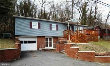 Nestled above the town, this rancher offers convenient access to the state park, while offering privacy on a dead end street.  Home features 3 BR, 1.5 BA, lovely galley kitchen & large sunny dining/living room with gleaming wood floors.  Bsmt. w/ Family Room & 1-car garage. Perfect for weekend retreat or full time living. Only Restriction is Residential purposes.