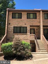 Multi-level townhouse style condo. The upper level entry features two master bedrooms, each with their own en suite full bath and ample closet space. The main level features an open floor plan, hardwood floors, a fireplace and a private patio. The staircase's signature exposed brick wall adds character and warmth to the spacious layout. Reserved parking in front of the unit  along with sufficient guest parking. Easy commute to Pentagon, Crystal City, Arlington, Amazon's HQ2 and more! Fresh paint neutral colors Apr 2024.