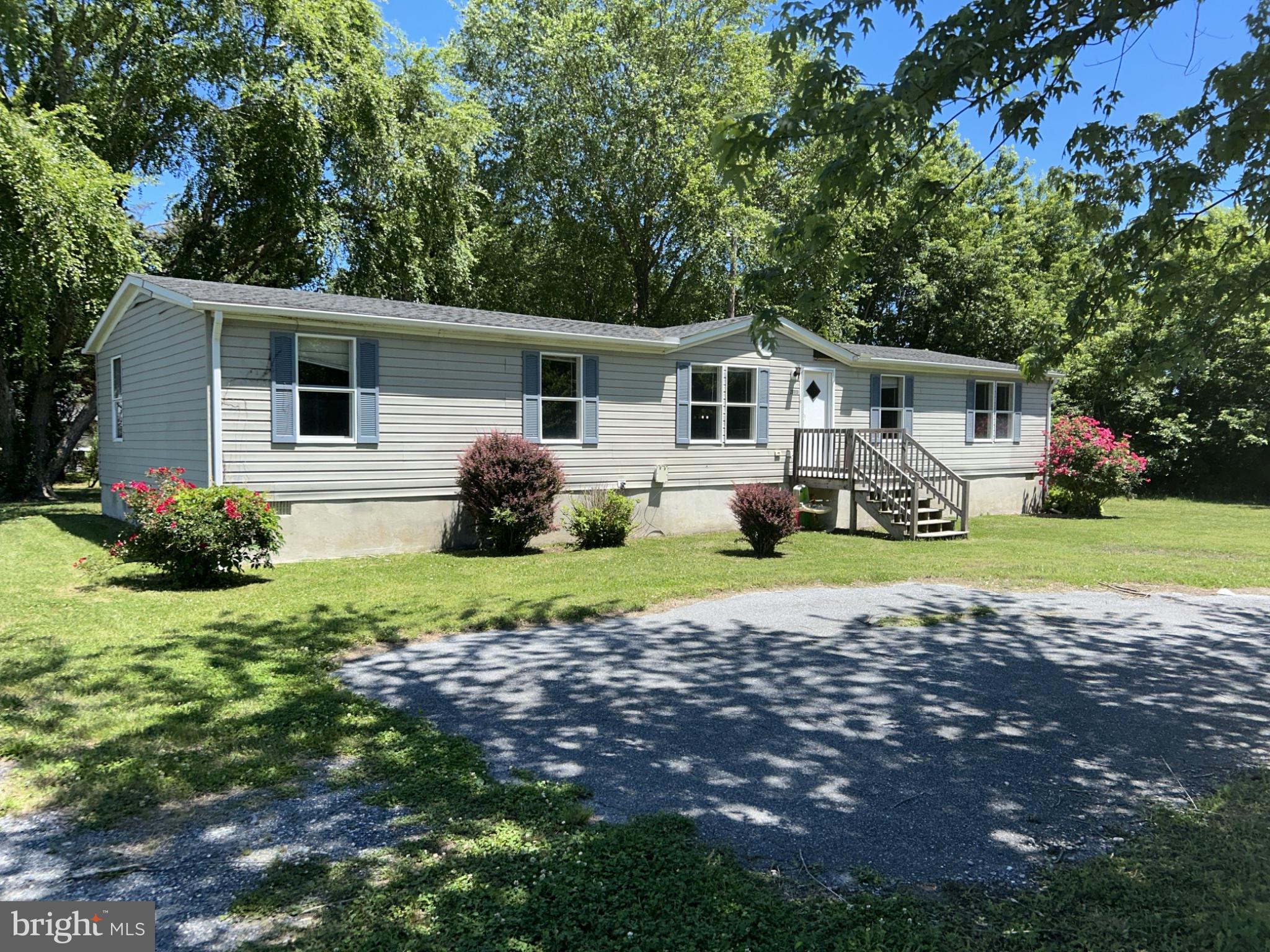 This 1997 Class C manufactured home presents a compelling investment opportunity, featuring a spacious double-wide design with three bedrooms and two full bathrooms. The interior boasts practical features such as ceiling fans, an entry-level bedroom, and a dedicated dining area, enhancing livability and tenant appeal. The kitchen is equipped with essential appliances, while washer/dryer hookups offer convenience for future occupants. Set on a generous 1.41-acre lot, the property is cleared and located in a cul-de-sac type location, providing a tranquil environment with potential for outdoor enhancements. The dirt driveway accommodates ample parking for multiple vehicles, making it attractive for all buyer types. Investors will appreciate the potential for rental income in a growing market, with the possibility of increasing value through strategic upgrades. This property combines functionality with a desirable location, making it a sound addition to any investment portfolio. This Property is Sold As-Is, In It's Present As-Found Condition, No Warranties Expressed or Implied! Proof of funds to purchase required to accompany all cash offers and decisioned Pre-Approvals for all financed offers!  SUBJECT TO FIRST LOOK PERIOD.  Property must be on market a minimum of 7 full days before offers are considered.