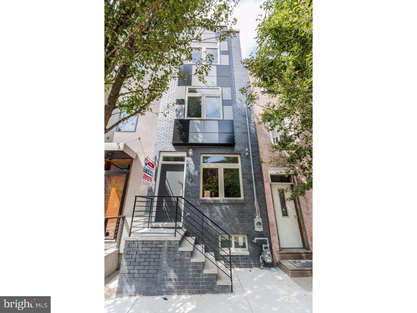 A towering Old Kensington (South Kensington) 3 story new construction with 10 year tax abatement, 3 bedrooms, 3 full baths, private yard, panoramic roof deck, and finished basement. This home has hand carved dark chocolate hard wood floors throughout, custom tile in the basement and in every bath, high end vanities and low flow toilets in all of the baths, recessed lighting and a front load stainless stacked washer and dryer on the 2nd floor level. The exterior front facade is beautiful with black brick and custom made steel hand rails in the front back and interior of the home. Enter in to the straight through open floor plan, filled with natural light. The dining room wall is open and leads to the beautiful finished basement.The kitchen comes with beautiful shaker cabinets, granite counters, glass subway back splash, stainless appliances, and access to the yard. The 2nd floor has 2 spacious bedrooms and a hall bath and laundry room. The 3rd floor is the master suite with walk in closet and there is stairs to the roof deck from the 3rd floor hall. Located in the highly desired neighborhood with only a few blocks from Fishtown and Northern Liberties offering easy access to everything.