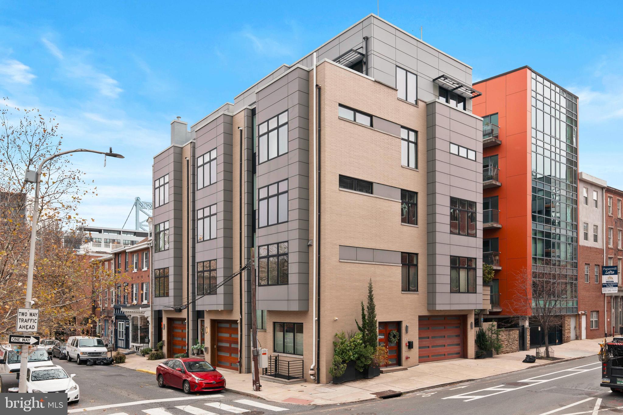 Discover refined city living in this remarkable five bedroom five and a half bath residence located in the cultural center of Old City. Thoughtfully crafted for effortless everyday living, this home offers rare two car parking, an in home elevator, and four distinct outdoor spaces that enhance both privacy and lifestyle. With three years remaining on a valuable real estate tax abatement, it delivers exceptional long term appeal.

The main level welcomes you with expansive, beautifully proportioned living and dining areas ideal for entertaining or unwinding. A stunning gourmet kitchen serves as the heart of the home, showcasing sleek Poggen Pohl cabinetry, Silestone surfaces, premium Miele appliances, and a generous breakfast bar. The adjoining living space is filled with natural light, anchored by a contemporary fireplace and framed by floor to ceiling windows and elegant coffered ceilings. Just beyond, a private terrace offers the perfect setting for quiet mornings or relaxed outdoor meals.

The primary suite is a serene sanctuary featuring a spacious bedroom, dual walk in closets, and an indulgent bath with radiant heated floors, double vanities, a deep soaking tub, and a separate glass enclosed shower. Every additional bedroom is paired with its own beautifully appointed custom bath, ensuring comfort and privacy for family and guests alike.

Ascending to the upper level, a bright lounge or den opens to a rooftop deck where sweeping waterfront views create a stunning backdrop for gatherings or quiet moments. The finished lower level expands your living options even further with a dedicated theater room, a full bath with a relaxing steam shower, and a versatile additional room ideal for a gym, playroom, or guest space.

Perfectly positioned near acclaimed dining, major medical facilities, and key transportation routes, this exceptional home captures the very best of luxury urban living.
