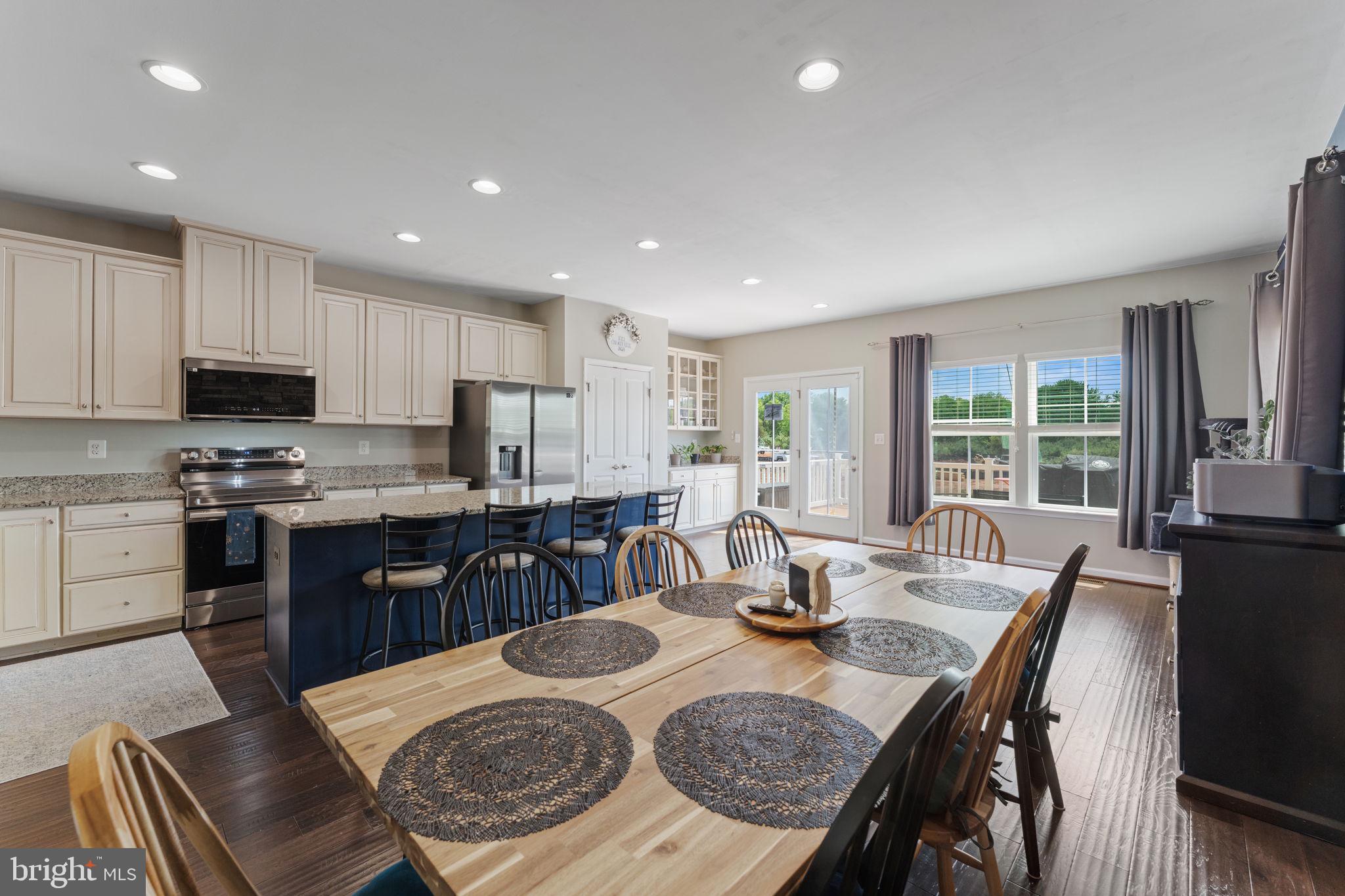 Motivated Seller !!! Beautifully maintained three-level end-unit townhome, built in 2016,
offering an exceptional blend of privacy, space, and thoughtful
Upgrades throughout. This residence features 3 bedrooms, 2 full baths,
and 2 half baths, along with a 1-car garage, and is ideally located
adjacent to Bennett Elementary School in a highly regarded school
district.
Inside, you’ll find high-end finishes at every turn, including
hand-scraped hardwood flooring on the main level and hallways,
hardwood in the primary suite, luxury vinyl in the finished basement
recreation room, and upgraded tile in all bathrooms, with no carpet
throughout. Additional interior highlights include recessed lighting
and a stylish stone accent wall, adding warmth and character to the
home.
The gourmet kitchen is a true centerpiece, showcasing a large center
island, granite countertops, stainless steel appliances, upgraded
cabinetry, and a spacious pantry, enhanced by matching 2024 Samsung
Smart kitchen appliances. A 2024 Samsung Smart washer and dryer add
modern convenience.
The primary suite serves as a private retreat, featuring a walk-in
closet and a spa-inspired bath complete with a soaking tub, double
vanity, and a separate shower with built-in seating. The upper level
is completed by two additional bedrooms and convenient bedroom-level
laundry.
Enjoy abundant natural light throughout, along with exceptional
outdoor living spaces including a composite deck with an electric
retractable awning and a paver patio off the walkout lower level. The
home is equipped with a Ring doorbell, security sensors, and Waze
camera system for added peace of mind. A Carrier HVAC system (2021)
has been recently inspected and serviced in 2026, along with an
inspection on the hot water heater, with the reports available in the
MLS documents.
The kid-friendly community offers outstanding amenities, including a
splash park, several playgrounds, walking trails, and a community
fishing pond, all just minutes from PW County Parkway, VRE, shopping,
and dining.