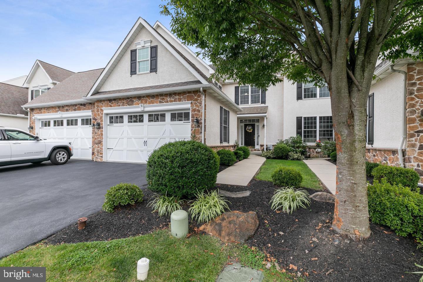 Welcome to this beautiful townhome with a stunning water view in the desirable Laurel Brooke community with walking trails. Enter into a grand two story foyer with a beautiful accent wall. The open concept floor plan is great for entertaining and everyday living! The kitchen has plenty of cabinet and counter space, a huge center island with seating, a large breakfast nook, stainless steel appliances and a pantry. It opens into the family room with a gas fireplace. A door leads to your large deck overlooking the community pond for a beautiful view. The living room and dining room flow seamlessly with the rest of the main level. An abundance of natural light pours in from the large windows. A half bathroom and access tor your two-car garage complete this level. On the second level you'll find three bedrooms including the expansive primary suite with his-and-her closets and vanities, a soaking tub, a stall shower and a water closet in the ensuite. The two secondary bedrooms are generously sized with ample closet space. They share a full hall bathroom with a dual vanity. Your ultra convenient upper level laundry room completes this level. If all this wasn't enough space, descend to the fully finished basement. With a large recreation room complete with another gas fireplace and built-ins, there is ample room to make this area fit your needs. There is also a half bathroom for convenience and a large storage area. Sliders lead out to your covered patio and back yard. This home is in a prime location minutes away from tax free shopping, close to Route 202, shops, restaurants, and schools. Schedule your showing today!