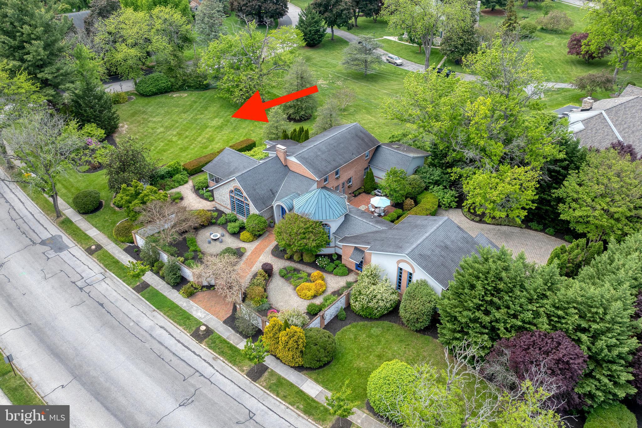 Beautiful open lot with professional landscaping.