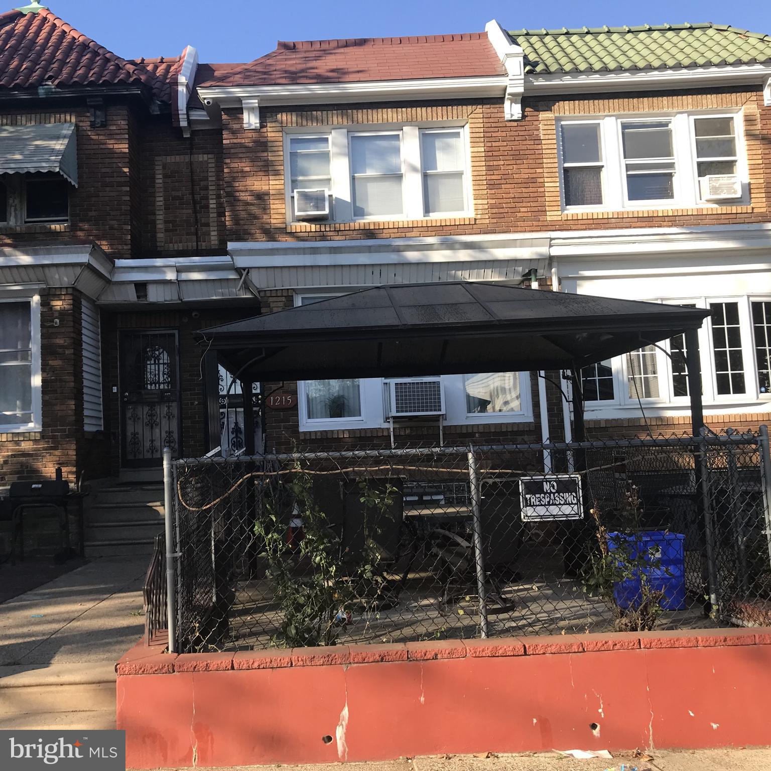 Excellent investment opportunity! This spacious two-story brick row offers strong fundamentals with a large living room, dining room, and kitchen on the main level. Upstairs features three good-sized bedrooms and a 3-piece hall bath. Full unfinished walkout basement leads to rear driveway parking. Located minutes from shopping, schools, transit, and major highways. Tons of potential!