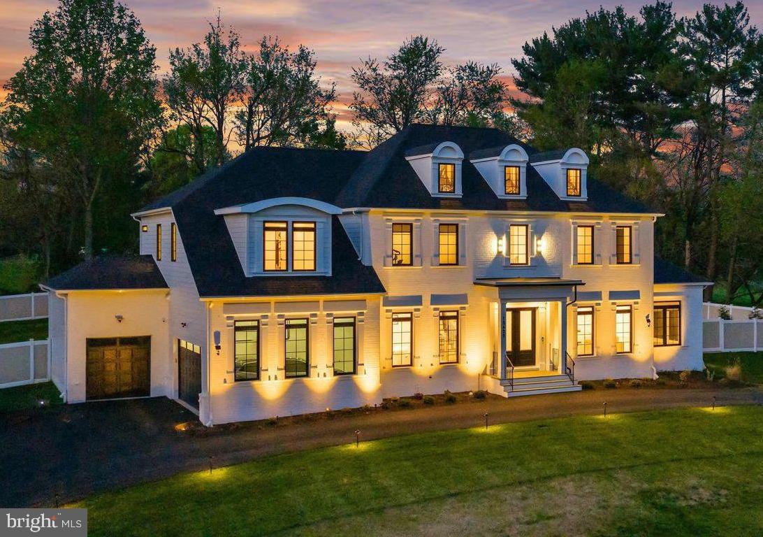 ***This is a “to be built” custom home and all photos are of recently completed “Signature Strauss” model.  Construction has not started yet***

Sited on a breathtaking private 3-acre wooded retreat along the scenic Brighton Dam Road corridor — one of Howard County's most sought-after and picturesque addresses — this spectacular custom estate delivers an extraordinary lifestyle defined by natural serenity and architectural elegance.  With award-winning Howard County schools, shopping, and major commuter routes all within easy reach, this premier residence offers the rare combination of a private woodland sanctuary and an exceptionally connected address.
The Signature Strauss plan features 6 spacious bedrooms and 6.5 baths on three  finished levels, all showcasing the soaring 10-foot first-floor ceilings and 8-foot interior doors that define the home's grand sense of volume. The dramatic two-story family room with its sweeping wall of windows anchors the open main level, complemented by a sun-drenched extended morning room and a private first-floor in-law suite with full bath — ideal for multigenerational living.
The chef's kitchen will impress, featuring a designer oversized island (fully customizable), subway tile backsplash, high-performance exterior-vented exhaust, and a generous $40,000 appliance allowance. Behind the main kitchen, a second culinary kitchen with walk-in pantry and its own $20,000 allowance provides the ultimate space for entertaining.
The expansive owner's suite offers dual walk-in closets and a spa-inspired bath appointed with a freestanding soaking tub, separate shower, quartz or granite countertops,  Five additional bedrooms — each generous in size — are served by beautifully finished baths with ceramic tile surrounds, designer mirrors, and choice of fixtures throughout.
The partially finished lower level extends entertaining possibilities with a recreation room, an additional bedroom, full bath, egress window, and a double areaway walk-up.  The stately painted brick façade, grand double front entry doors, covered porch, stone stairs, classic dormers, hip roof, and modern black grid windows create a dramatic exterior impression, completed by a three-car garage with two side-load bays and a courtyard carriage-style bay.
Luxury estate inclusions: dual-zone HVAC systems (electric with propane backup), a 1,000-gallon buried propane tank, 400-amp electrical service, a 75-gallon rapid recovery water heater, an EV charging outlet, smart thermostat, video doorbell, and a fire sprinkler system. Over $170,000 in personalization allowances — for flooring, cabinetry, appliances, windows, and more — ensure this home reflects your own unique vision. Backed by Homeowner Warranty and the attentive builder process, this is Howard County luxury living at its finest.  Call for floorplans and more information.