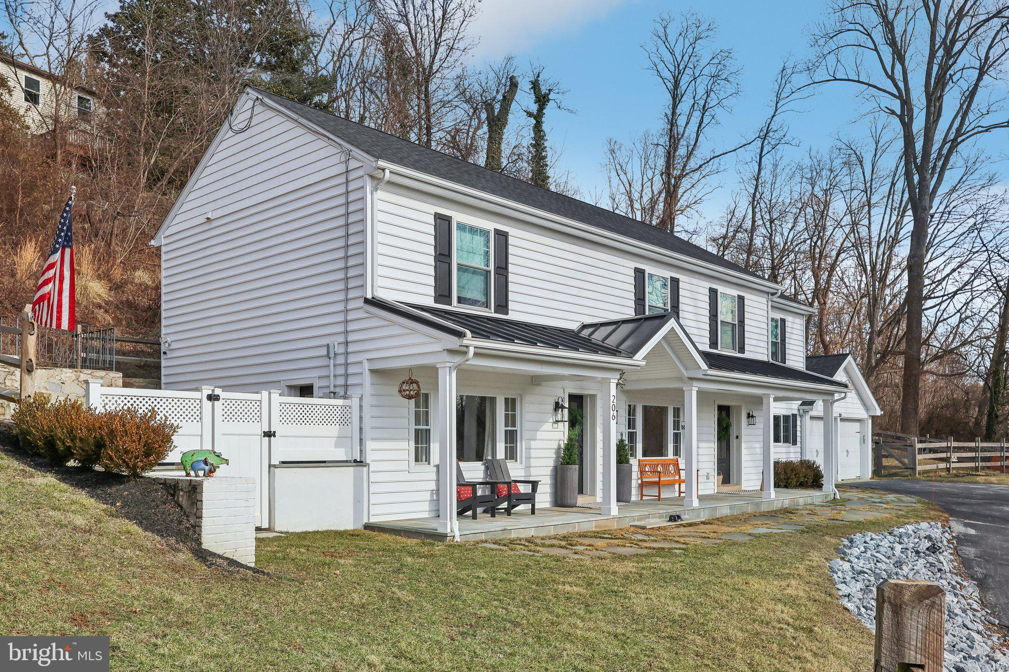 Welcome to 206 Upper Gulph Road – a 3 bedroom, 2.5 bathroom renovated masterpiece! From the sleek slate walkway that leads to the front porch, step inside and be welcomed by the warm, hickory hardwood floors that flow seamlessly throughout the home. The chef's kitchen is a true showstopper, featuring Century cabinetry and equipped with top-of-the-line Bertazzoni Spa appliances, including a 5-burner gas range. White quartz countertops, double pantries, and a center island make this the perfect space for entertaining. The dining area comfortably accommodates up to 10 guests, with a custom-built bench that blends style and function. The living room is centered around a remote-controlled gas fireplace with a slate hearth and built-in bookshelves. From here, step out onto a private, gated stone patio nestled in one of two side yards. The first floor also includes a powder room and a versatile mechanical storage room, offering the flexibility to create a home gym or storage for workout gear. Thoughtfully placed, there’s also a wall receptacle for a TV to enjoy live-streamed workouts. Upstairs, the primary suite offers two walk-in closets and a spa-inspired bath complete with a rainfall shower, double vanity, and a make-up vanity area. Two other spacious bedrooms share the tiled hall bathroom and a convenient laundry room completes this level. From the second-floor, step outside to a fully enclosed backyard- beautifully crafted post and rail fence with three gates. This graded and fenced area provides the potential for a built-in pool while the koi pond offers tranquility and relaxation during the warmer months. This home also features a circular driveway with ample off-street parking, plus a two-car garage that can be accessed from either side of the drive. With picturesque views of the Villanova hills from the front, this home is just minutes from Villanova University, major roads, shopping, public transportation, and Downtown Philadelphia. The community is rich in history and offers beautiful parks, top schools and universities, all while benefiting from the low taxes of Upper Merion Township. Don’t miss the opportunity to own this low maintenance, fully renovated, open concept home—it truly is special. Schedule your private tour today!