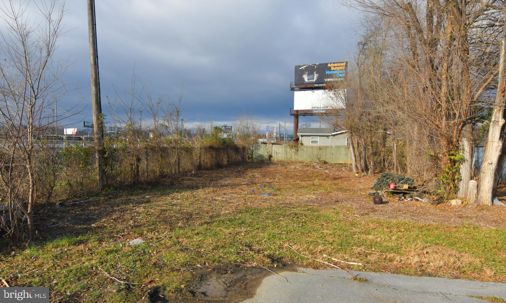 EASILY AFFORDABLE! SUITABLE FOR A HOME OR TRAILER. Vacant, level lot near Rt. 45/Apple Harvest 
Drive and Foxcroft Avenue. Convenient to I-81 and downtown Martinsburg. Lot size 0.052 acre. 
Sold strictly as-is, where is. Cash only. Buyer to verify water and sewer availability and whether lot is suitable for buyer's intended use. Per the Berkeley County Water and Sewer Department, water and sewer are available.  May be subject to tap fees. Also, may be subject to new impact fees for houses, multi-family and mobile homes that must be paid before a building permit is issued.  The Eastern Panhandle is one of the fastest growing areas of West Virginia. Residents of Martinsburg and Berkeley County are attracted to the small-town atmosphere, employment opportunities, restaurants, shopping, services, medical facilities, a revitalizing downtown, and access to major roads, the MARC train and Amtrack. Cash only - proof of funds required.