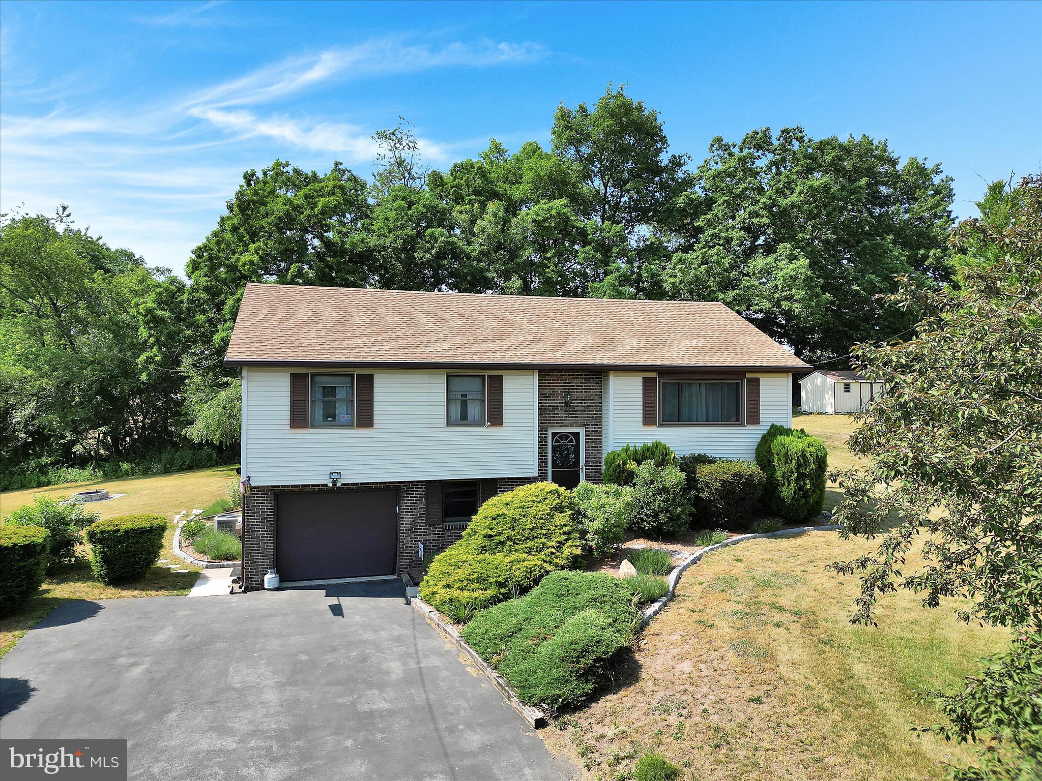 Welcome home to this stunning, move-in ready 3-4BR/3BA spacious bi-level in the desirable, gated, lakes community of Lake Wynonah!  Lake Wynonah is Pennsylvania's best kept vacation destination secret. This .9 acre parcel BACKS TO FARMLAND is located in Lake Wynonah HOA, a CAI GOLD STAR LAKES COMMUNITY. You'll be impressed with the updated LVP flooring throughout the kitchen, dining area, living room and hallway. Kitchen features Quartz countertops and beautiful cabinets. 3 spacious bedrooms on the main level. Sprawling, rear deck off the kitchen is the perfect outdoor space for your summer morning brews and evening barbeques! The lower level offers a potential, additional bedroom or office and family room; family room with functional and efficient coal stove. Large lot with exceptional open space views. Newer deck and fenced backyard area/dog run. Attached, built-in one car garage and plenty of driveway parking. Newer appliances installed in 2022. Central air. Newer roof. On-site septic. Schedule your showing and bring your best offer!  Lake Wynonah is a gated lakes community, featuring 2 gorgeous, pristine freshwater lakes (Lake Wynonah is approximately 90 ft. deep and Fawn Lake 45 ft. deep at deepest areas). Amenities include: business office/gathering room/library, lodge w/dining and bar, social clubs, boating, fishing, wakeboarding, waterskiing, tubing, paddleboarding, tennis, pickleball, several parks/pavilion, newer basketball courts, horseshoe pits, 2 pools, beautiful docks, hiking, natural wildlife and marina. Groups and events include: Active Civic Association, Dances/Concerts, Book Group, Lodge Group, Pinochle Group, Volunteer Programs, Fish & Boat Group, Exercise Classes, Senior's Monthly Dinner. Located less than an hour from Allentown, Harrisburg and Reading. Schuylkill County and surrounding counties offer some of Pennsylvania's premier hidden gems, including Hawk Mountain Sanctuary, Crystal Cave, Lehigh Gorge Scenic Railway, Pioneer Tunnel Coal Mine, Cabela's, Anthracite Outdoor Adventure Area which has been named one of the top 10 destinations in the country for ATVs, full-size vehicles and dirt bikes. Hundreds of miles of diverse trails on 6,500 acres. Yuengling Brewery, Whitewater Adventures, Hope Hill Lavendar Farm, Fighter's Heaven, former training camp of Muhammad Ali, many breweries, wineries and distilleries, state & county parks including Weiser State Forest, parades, festivals, covered bridges, biking, Appalachian Trail hiking, fishing, canoeing and camping opportunities. Relax, restore, rejuvenate! Beat the beach traffic and settle in at the lake. Lake Wynonah is "Life On Vacation"!