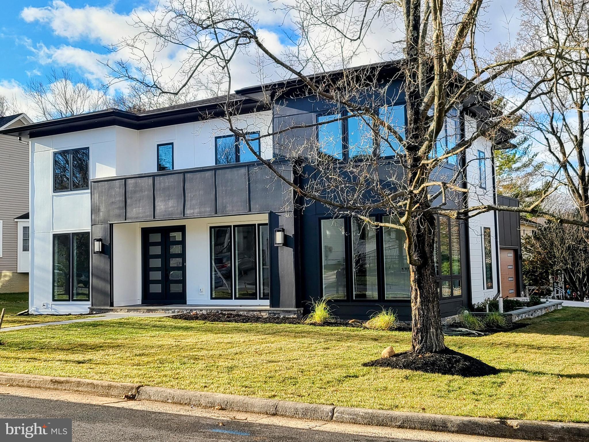 STEP INTO A WORLD OF ELEGANCE AND COMFORT - Welcome to this extraordinary custom-designed home, thoughtfully curated with impeccable attention to detail and the finest quality craftsmanship. Spanning  nearly 6,000 square feet, it boasts six bedrooms with en-suite bathrooms, 2 elegant powder rooms and a 2-car garage. The residence combines modern convenience with timeless design, creating the perfect setting for both luxurious living and everyday functionality. A STUNNING FIRST IMPRESSION - As you enter through the elegant foyer, you're greeted by 10-foot ceilings, exquisite tray and suspended ceiling designs, and light oak flooring that flows seamlessly throughout the main level. Modern lighting accents create an ambiance that is both inviting and sophisticated—ideal for hosting elegant soirées or enjoying quiet family moments. CULINARY DREAMS COME TO LIFE- The Chef's kitchen is nothing short of spectacular, featuring state-of-the-art Thermador appliances, quartz countertops, and a butler's pantry complete with a beverage center and expansive walk-in pantry. A sprawling center island with seating takes center stage, connecting effortlessly to a sunlit breakfast nook framed by floor-to-ceiling windows. Adjacent to the kitchen, the family room boasts a cozy fireplace and opens via accordion doors to a screened-in porch, wired for entertainment and relaxation—ideal for gatherings or relaxing evenings. MAIN LEVEL VERSATILITY - The main floor also offers a secluded guest suite with an en-suite bath, a chic powder room, and a functional mudroom with  a spacious family coat closet, built-in cubbies and a sink, leading to the attached two-car garage. Every detail is designed to enhance comfort and practicality. YOUR PRIVATE RETREAT - The upstairs owner's suite is your personal sanctuary. Indulge in a spa-inspired bathroom equipped with dual rain showers, handheld fixtures, a stand-alone soaking tub, and dual vanities, all complemented by a massive walk-in closet and a private terrace. Each of the additional three bedrooms features its own en-suite bath, ensuring comfort and privacy for all. A spacious, fully outfitted laundry room adds convenience to this level. ENTERTAINING MADE EASY - The lower level is designed for leisure, featuring a sprawling recreation room with a wet bar, a  media room, a guest powder room, and an additional bedroom with a full bath. Whether hosting guests or enjoying a quiet night in, this space is ready to accommodate any occasion. MODERN LIVING AND CONVENIENCE - This stunning six-bedroom residence is equipped with a surround sound and security system. Located with easy access to I-66, I-495, East and West Falls Church Metro Stations, and top-rated McLean schools, it provides both luxury and accessibility. SCHEDULE YOUR PRIVATE TOUR TODAY -  Discover the blend of style, functionality, and convenience that makes this home truly exceptional. Contact us to schedule your private tour and see it for yourself.