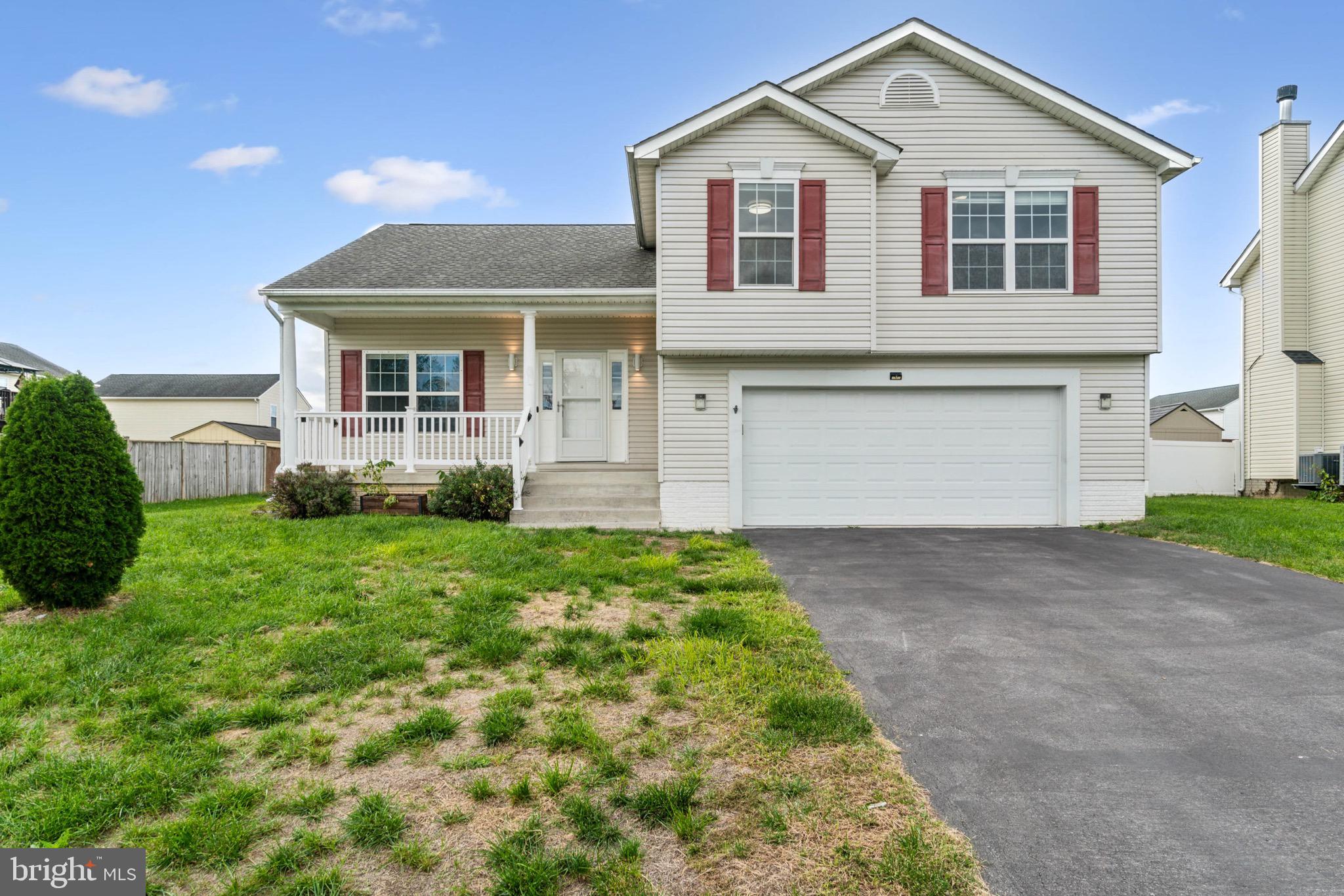 This delightful 3-bedroom, 2.5-bath split-foyer home features a spacious primary bedroom with its own private bathroom, ensuring comfort and privacy. The home also includes a generous basement great room with new carpet, a half bath, and a laundry area. Outside, enjoy a fully fenced backyard with a trampoline and a rear deck perfect for outdoor gatherings. Additional features include a welcoming front porch and a 2-car garage.