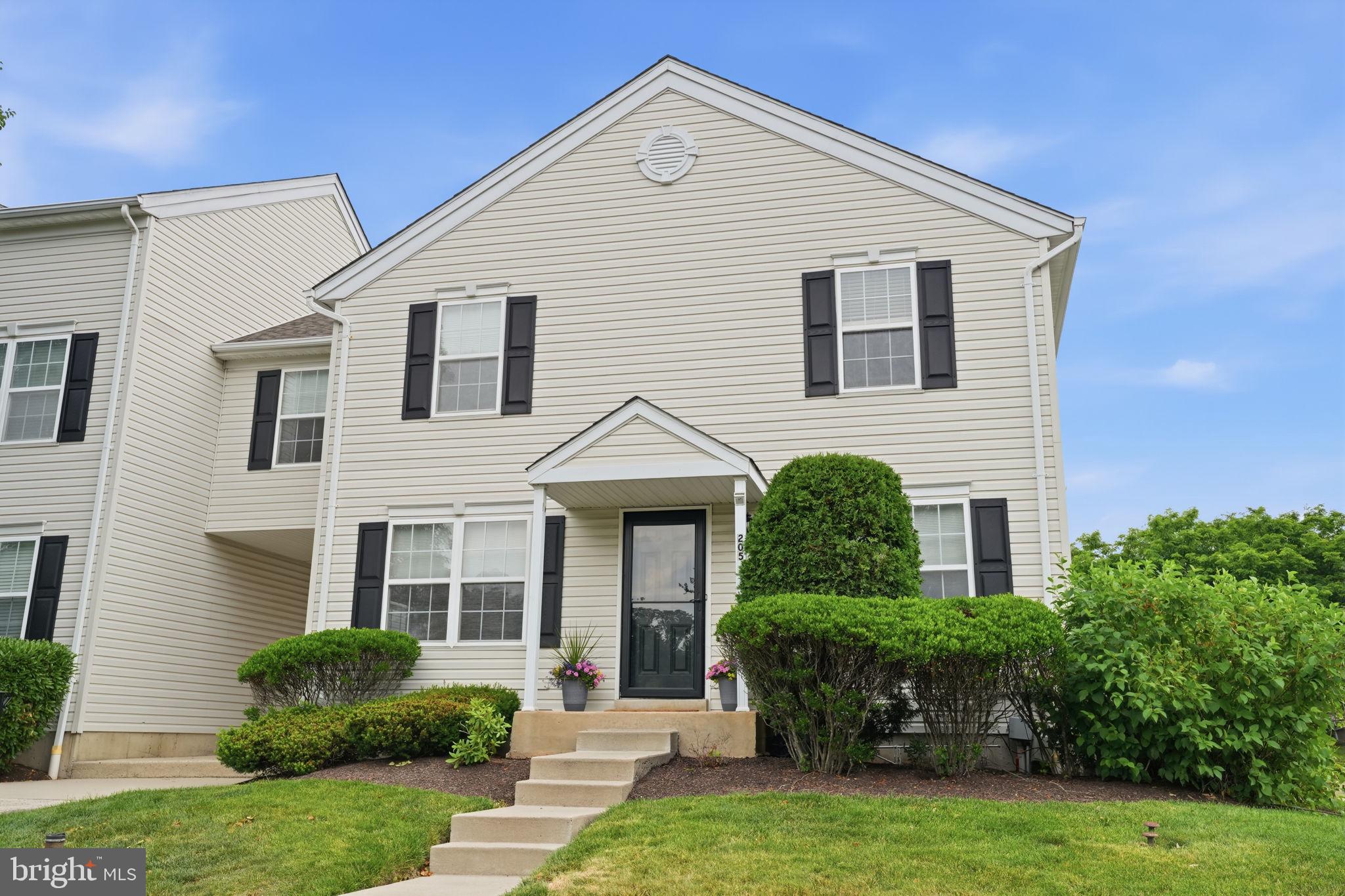 Welcome to this bright and spacious 3-bedroom end-unit townhome-style condo in Warrington’s desirable Bradford Greene community. From the moment you step inside, the home feels open and inviting, with windows on multiple sides filling the living room with natural light and giving the main level an airy, open feel that sets this larger model apart.

The main floor offers a comfortable, functional layout with a generous Living Room and Dining Room that work beautifully for everyday living and entertaining. The Dining Room flows into the Kitchen, which offers an efficient layout with ample cabinet and counter space. Whether you are hosting, working from home, or enjoying a quiet night in, the home offers the space and flexibility to fit the way you live.

Upstairs, the expansive primary bedroom offers excellent closet space, including a walk-in closet, along with room for a sitting area, home office, reading nook, or private retreat. Two additional bedrooms are well-proportioned with ample closet space, providing flexibility for family, guests, or a dedicated work-from-home setup. The hall bath includes a tub/shower combination, and a convenient powder room serves the main level.

The finished lower level is a true bonus and gives this home something memorable. Previously designed with a media-room feel, the space includes tiered flooring, sound-treatment panels, and pre-wiring already in place, creating an exciting starting point for a future theater room, gaming lounge, home gym, office, studio, or additional living area.

Residents of Bradford Greene enjoy community amenities including common grounds, playgrounds, and basketball courts, along with the ease of low-maintenance living. The monthly association fee covers roof and siding maintenance, door painting, landscaping and mulching, snow removal right to your door, and trash service. Ideally located close to shopping, restaurants, grocery stores, and major commuter routes, the community also connects directly to Nike Park, offering walking trails and direct access to nature. Located within the highly regarded Central Bucks School District, this home offers the perfect combination of space, comfort, convenience, and community.

Bright, spacious, and full of possibility, 205 Tanager Court is the kind of home that stands out. Don’t miss the chance to see it in person!