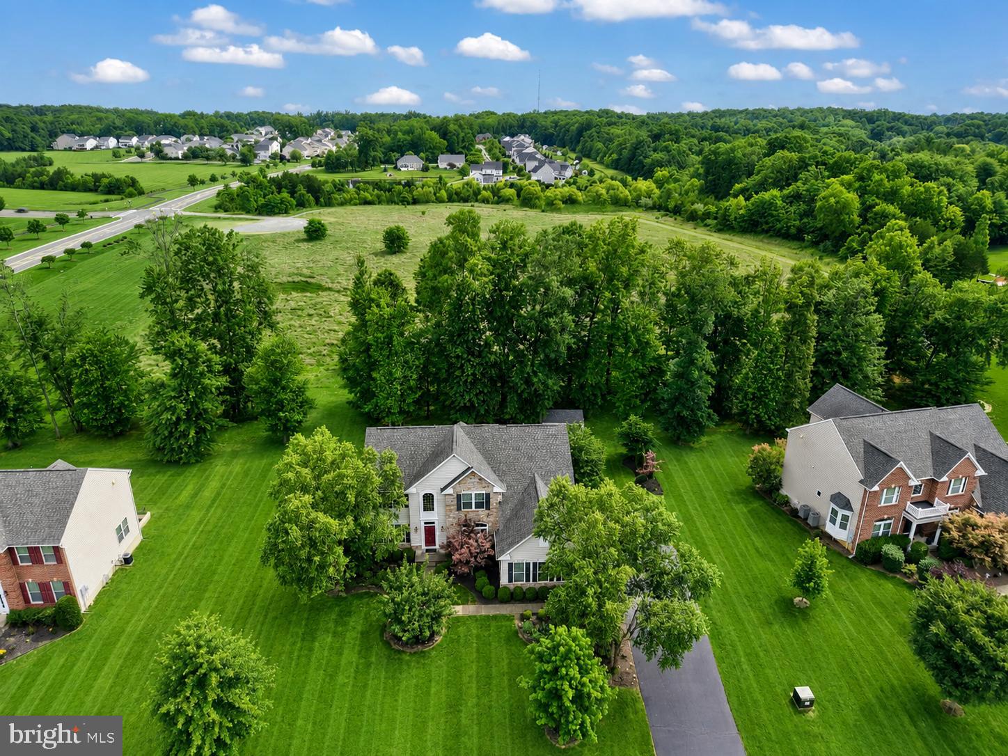 Welcome to this stunning home nestled in the highly sought-after Brookside community on the DC side of Warrenton—where elegance, comfort, and lifestyle come together beautifully.

From the moment you arrive, the charming partial stone front sets the tone for the impressive features within. Step inside to a grand two-story foyer with soaring 20-foot ceilings that create an unforgettable first impression. The main level offers a refined office complete with hardwood floors, crown molding, and French doors—perfect for working from home in style.

Designed for both entertaining and everyday living, the spacious living room and formal dining room are filled with natural light and enhanced with classic crown molding. At the heart of the home is a truly exceptional gourmet kitchen, featuring expansive 10-foot island with Granite countertops. The island features cabinetry on both sides & Stainless steel appliances—including a brand-new dishwasher (2026) and refrigerator replaced (2022).

The adjoining morning room provides the perfect space to enjoy casual meals while overlooking the backyard. Just beyond, glass doors lead out to an impressive two-tier Trex deck  and a gorgeous stamped concrete patio-(a $50K investment), ideal for outdoor entertaining or relaxing evenings.

The family room is nothing short of spectacular, highlighted by a dramatic floor-to-ceiling Natural gas fireplace that serves as a stunning focal point and Brand new carpet. A convenient powder room & a well-appointed main-level laundry room add to the home’s everyday functionality.

Upstairs, the luxurious Primary suite offers a peaceful retreat with a tray ceiling, a spacious walk-in closet and an additional custom-designed closet system valued at $14K. Brand-new carpeting throughout the home (costing $8K) adds a fresh and inviting feel. The second  spacious bedroom features its own private En-suite bath, while bedrooms three and four are generously sized and share a recently Renovated hallway full bath with dual sinks.

The fully finished Walkout basement expands your living space even further, featuring a large recreation room, play area, and a full bath. An enormous bonus room offers endless possibilities—perfect for a 5th bedroom, home gym, workshop, or craft space. 

**The Hot Water heater was replaced with an "On-demand system" in (2022) cost $3400**

Completing this exceptional property is a 3-Car side-load garage equipped with an EV charging station!

Perfectly located for convenience, this home offers easy access to Routes 29, 15, 28, and I-66—making commuting a breeze. Enjoy being just minutes from Wegmans, shopping, dining, medical facilities, and everyday essentials.

Brookside is an amenity-rich community designed for an active and social lifestyle, featuring two outdoor pools, a kiddie pool, two clubhouses with party room, fitness center, scenic walking and biking trails, tot lots, and multiple sports courts including basketball, volleyball, and tennis.

This home truly has it all—space, style, upgrades, and an unbeatable community. Don’t miss the opportunity to make it yours!