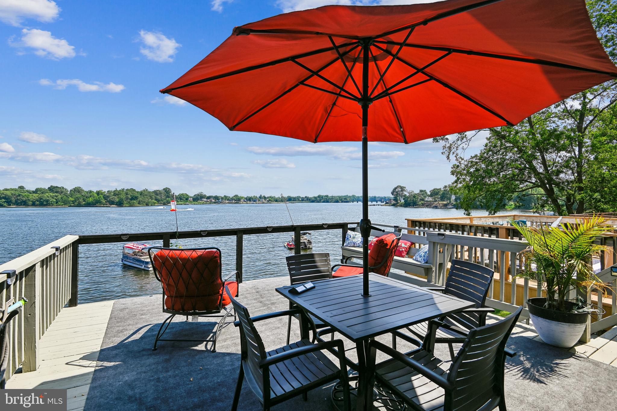 Photos Coming!
Step into paradise with this stunning 3-bedroom, 2.5-bath waterfront townhome, located just steps from the sandy beach. Designed for effortless coastal living, the main level features rich hardwood floors, vaulted ceilings, and a gourmet kitchen with premium stainless steel appliances. The expansive living area revolves around a dramatic 12-foot sliding glass door, framing unobstructed water views and opening directly to a massive waterfront deck perfect for outdoor entertaining. The versatile lower level expands your living space, offering a private home office, a cozy family room centered by a sleek electric fireplace, and separate sliders leading to a private patio overlooking the water. Boaters and outdoor enthusiasts will rejoice: you can moor your boat right outside or utilize the community’s private boat ramp, boardwalk, and dedicated storage for boats, watercraft, and RVs. Nestled in a premier community, amenities include a sparkling waterfront pool, walking/jogging paths, tennis courts, and a waterfront park complete with picnic tables and grills. Enjoy the ultimate blend of tranquility and convenience with fast access to shopping, major commuter routes, and BWI Airport. Your dream coastal lifestyle starts here!
