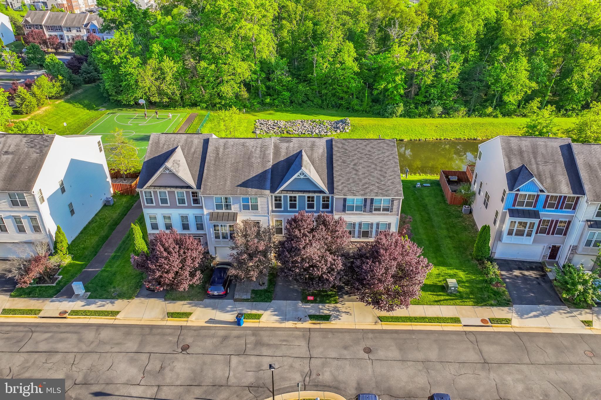 Just listed! Located  minutes from Brambleton Town Center, Broadlands shopping center, Metro station, Dulles Airport and so much more.   The large rec-room in on the entry level could be used as a 4th bedroom as it has a full bathroom on this level.  The kitchen  has hardwood flooring, gas cooktop, wall oven, microwave and refrigerator.   Off of the kitchen is a large trex deck that overlooks a pond and trees.   There are stairs from the deck leading to the patio below.   The primary bedroom has a walk in closet, large bathroom with dual sinks, soaking tub and separate shower.