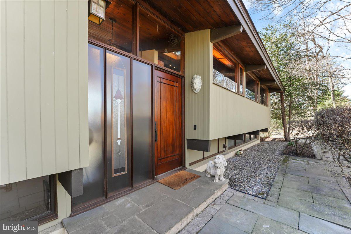 Don't miss this rare find, with spectacular 360° views from every angle and window of this beautifully maintained custom Deck House, tastefully situated on 3.6 acres at the end of a charming lane, overlooking the magnificent Chester County countryside.  The exterior was originally landscaped professionally and has been lovingly updated and maintained through the years. The kitchen has been updated as well, with granite Island and matching countertops. Other kitchen features include tumbled marble tile, KitchenAid electric glass top stainless steel range, KitchenAid stainless steel dishwasher, and stainless steel Viking refrigerator. The first floor also features a large living room with a wall of glass, with outside deck access & a beautiful brick fireplace. The dining room is off the kitchen, as well as a glass enclosed additional room on the same level, which could be used as a den, a study, a sunroom or whatever you would like it to be, to capture the peaceful scenic views it provides. The first floor also features the master bedroom and bath & an additional bedroom, which is currently being used as a sewing room. Wood flooring is featured through much of the main and lower levels. The lower level offers another wall of glass with panoramic views and another brick fireplace, two more bedrooms and one bath, as well as tucked away laundry and storage rooms. The oversized two car detached garage is spacious with all new electrical wiring. Savor the joy of true countryside living, while having the convenience of premier shopping centers, historic Kennett Square and all its five-star restaurants,  And the beauty of Longwood Gardens, all within a 3-mile radius. The Pennsylvania turnpike and the Pennsylvania airport are a 40-minute drive and downtown Wilmington is a mere 20-minute jaunt from your home. This gracious contemporary, its ample acreage as well as its stunning, relaxing views , is a valued  gem in today’s market! 1 hour notice is required with confirmed showings. Sunstone Lane is a private lane which the maintenance and snow removal is done by a gentlemans' agreement amongst the 7 homeowners on the lane.  When maintenance/snow removal is necessary, the homeowners are each billed 1/7th of the cost.