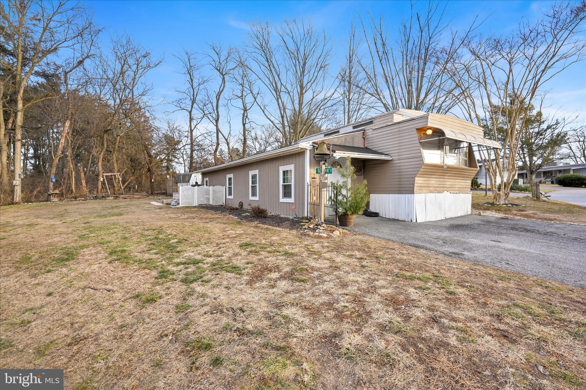 This 3-bedrrom, 1-bath manufactured home in the highly sought after Starview MHP in Mount Wolf features a 9' x 45' addition completed in 2020 with permits and up to code, creating a spacious living area.  Updates from 2020 also include HVAC, electrical, and roof improvements. The property sits at the quiet end of the park on a generous lot with a shed, two concrete slabs ideal for outdoor seating or projects, and a French drain with stone to manage runoff from the addition.  The layout includes a bright living room, functional kitchen and flexible spaces created by the addition.  Enjoy comfortable one-level living in a central location while still being tucked away in a peaceful setting.  Lot rent includes sewer and trash, and buyers must be approved by park management prior to occupancy.