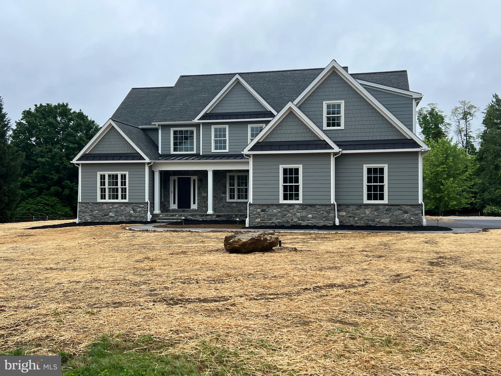 New Construction Chester Springs.  Custom Builder BJ Homes is building another unique home. The plan is ready to go and digging and clearing are underway. There is still time to customize the home to fit your needs.  First floor offers a second Primary  BR suite. A huge Gourmet Kitchen customized to your individual choices. The finish work includes Hardwood flooring throughout the home, Custom molding as well as crown molding and many additional finishes. The Large LR offers gas FP with sliders to a view of the 6 acre lot.
The second floor offers 4 additional BR  including a second Primary BR Suite. The basement will have high ceilings and could easily be finished.  This is a clean canvas for you to complete your dream home.