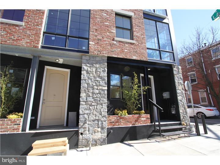 Welcome to a Premier Luxury New Construction development located at 1001-1005 New Market Street in Northern Liberties. This is a Private GATED Development with 2-CAR PARKING and 10-year TAX ABATEMENT. Some amazing features include: 4 story, 3 bedroom 2.5 baths, 1 car parking, private balcony and patio, private green roof, finished basement, open staircase, recessed lighting throughout, 10' windows, and dual HVAC. 1st floor: 2 story stone ventless gas fireplace entry, large open living area, 20' cathedral ceilings, french doors to rear yard and half bath. 2nd floor: loft dining room with glass partition, dining room overlooks stone fireplace, interior terrarium ledge, kitchen with peninsula and seating, built-in pantry and refrigerator station, modern open kitchen layout, and slider doors to kitchen level deck. 3rd floor: 2 large bedrooms, hall bath with soaking tub, and laundry and utility room. 4th floor: master bedroom suite, master bath with standing glass enclosure, claw-foot tub, master closet, flex space, and rear bedroom balcony. Exterior Features: reclaimed brick and raw granite facade, parking in rear, and front patio space. Other green features include reclaimed hardwood floor, energy star appliances, rain barrel collection system, and spray foam insulation. Project has award winning architect and 10 year tax abatement.  Located in the heart of Northern Liberties, a stones throw from Jerrys Bar with immediate proximity to all of the great spots in the neighborhood including The Standard Tap, North Bowl, One Shot Coffee, Liberties Walk and North Shore Beach Club.   Is a premier and sophisticated project with a price below other new construction.   This is a must see.