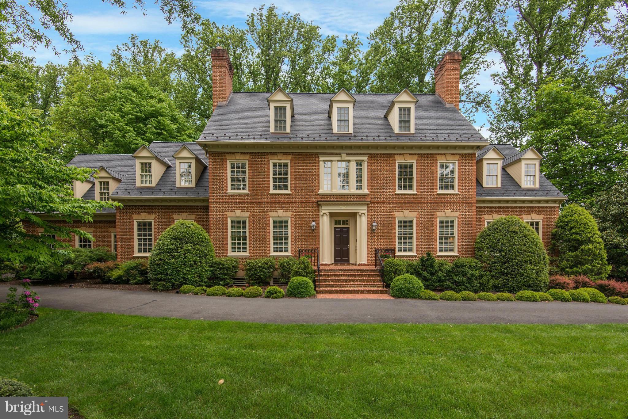 Stately Georgian colonial on lushly landscaped lot in sought after Millwood * Boasting over 10,000 sf of living with main level bedroom * Rich in architectural details including 10 ft ceilings & seven fireplaces, Great room with walls of windows, two story grand foyer, paneled library with wall of built-ins & sun drenched morning room * Walkout lower level with kitchenette & in-law suite