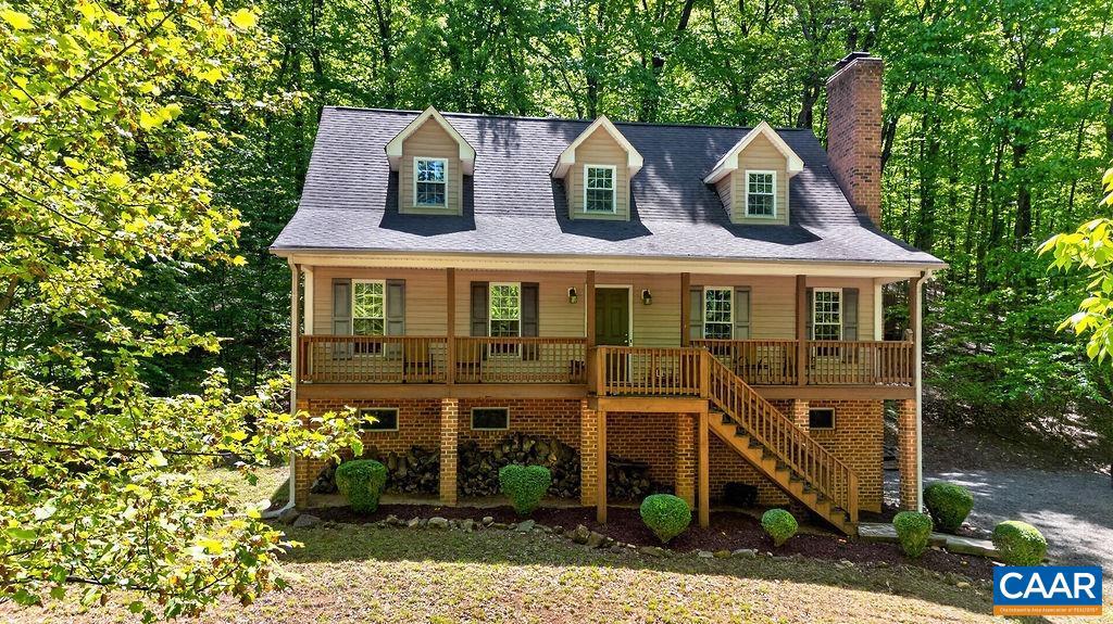 Charming 3-bedroom, 2-bath cottage nestled on a private 1.5-acre cul-de-sac lot in a fantastic location. This inviting home features hardwood floors, an eat-in kitchen, and a cozy living room with a wood-burning fireplace. The upper level offers a spacious primary suite with a loft area, perfect for a home office or reading nook. The unfinished basement already includes plumbing and is ready to be finished for additional living space. Conveniently located near Wintergreen Resort, breweries, cideries, and all the outdoor recreation Nelson County has to offer. Also within minutes to scenic walking around Glenthorne loop and Hiking trails!!