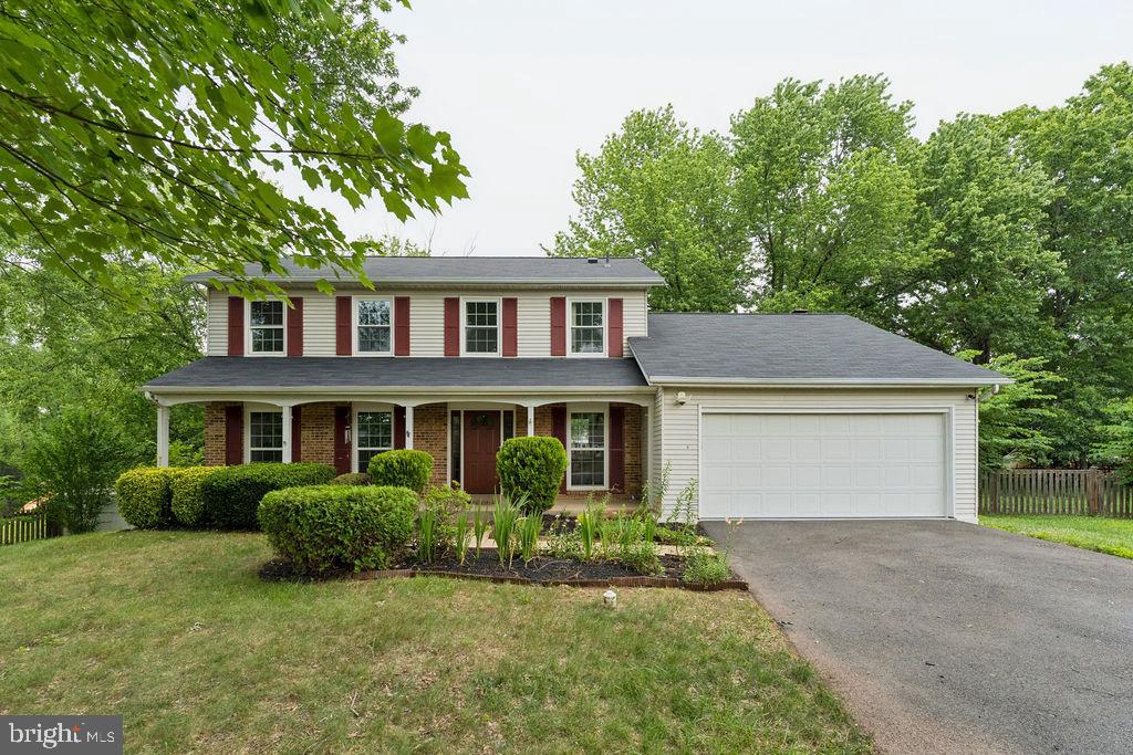 Welcome to this beautifully maintained Colonial home offering three finished levels of comfortable living, tucked away on a peaceful cul‑de‑sac. The main level features a bright kitchen with stainless steel appliances, a cozy breakfast nook, quartzite counters, and a warm family room with a fireplace. Step outside to a spacious deck, perfect for entertaining, overlooking a large, beautifully landscaped backyard.
Upstairs, you’ll find four generous bedrooms, each with abundant closet space. The primary suite includes a large walk‑in closet and a private dressing area. The fully finished basement provides incredible flexibility—ideal for a recreation room, home office, or even an in‑law suite.
A wonderful blend of space, comfort, and location. Easy .access to shopping and dining. 10 min to Manassas VRE. A MUST SEE!