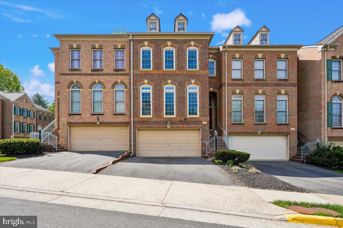This luxury brick-front townhome offers 3 finished levels, 3 bedrooms, 3.5 bathrooms, and a 2-car garage, combining elegant finishes with modern functionality.
The home features beautiful hardwood floors, custom crown molding, high ceilings, and an open, light-filled floor plan ideal for both everyday living and entertaining.
The gourmet kitchen is equipped with granite countertops, a stylish backsplash, center island, Wolf gas cooktop, stainless steel double oven, stainless steel refrigerator, and a new dishwasher. There is ample space for an eat-in table, and access to a large Trex deck—perfect for outdoor dining.
The upper level includes three spacious bedrooms and two full bathrooms. The primary suite features a tray (cove) ceiling, generous closet space, and a luxurious en-suite bathroom with a soaking tub, separate shower, dual vanities, and a private water closet. The additional bedrooms are well-sized and share an updated hall bathroom. A new washer and dryer are conveniently located on the bedroom level.
The lower level offers a cozy gas fireplace, built-in bookshelves, and a full bathroom, with walk-out access to a fenced backyard featuring a brick patio.
Additional highlights include solar panels for energy efficiency and lower utility costs, as well as an EV charger in the garage, pre-wired with an additional 220V line for a second charger.
Fabulous community with playgrounds, tennis court, basketball court, scenic walking trails, and plenty of guest parking. This home offers a perfect blend of comfort, style, and modern conveniences, and is ideally located minutes from Harris Teeter, Costco, Wegmans, Whole Foods, Home Depot, Fairfax Corner, Fair Oaks Mall, Fair Lakes Shopping, and an array of restaurants and shops. Commuters will love the quick access to I-66, Route 50, Route 29, and Fairfax County Parkway—making travel easy in any direction.