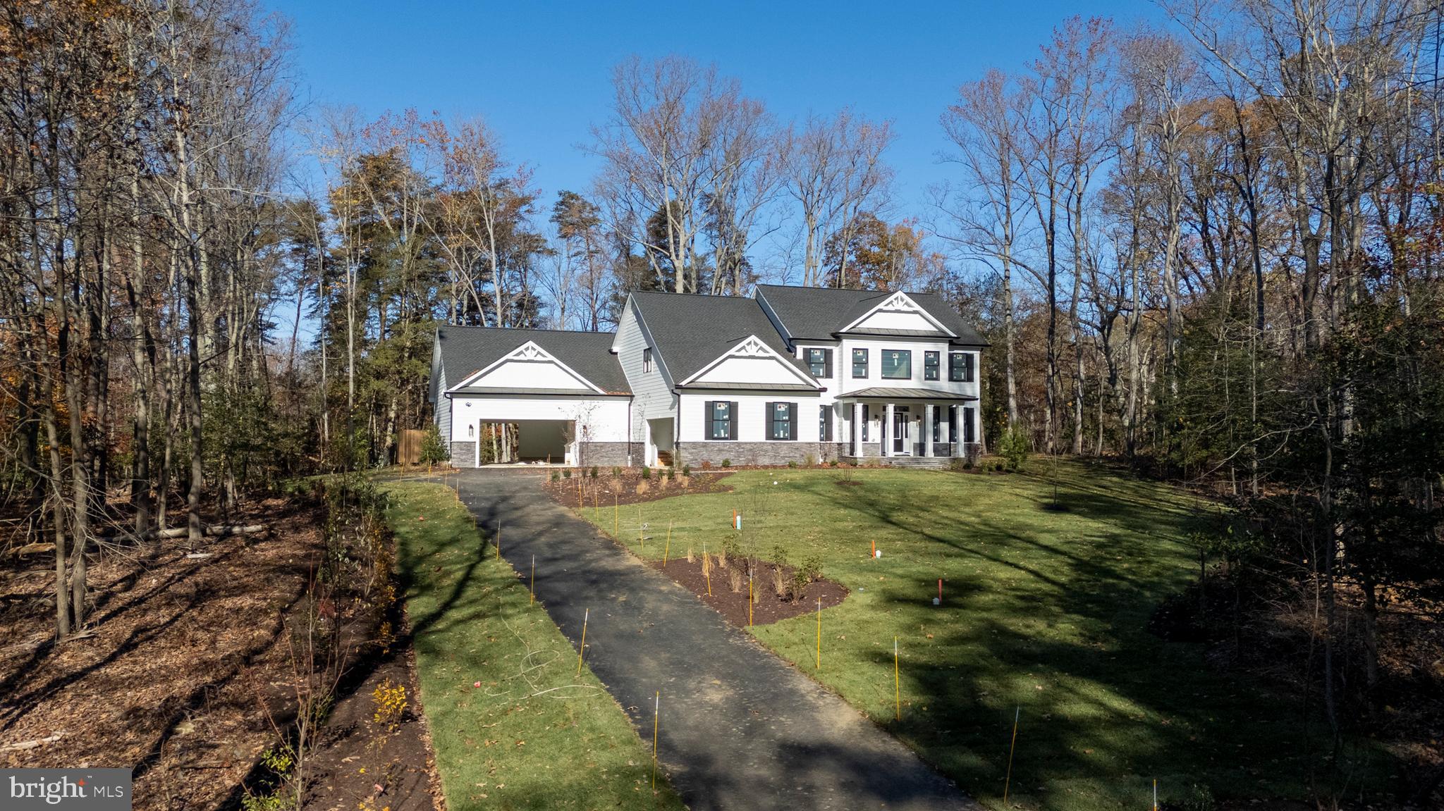 Discover an unparalleled opportunity to own a piece of paradise at 522 Ferry Point Road, a stunning new construction home nestled on 3.37 acres of secluded private land at the headwaters of Crab Creek. Enjoy the perfect balance of seclusion and convenience, with downtown Annapolis and major highways just a short drive away. This exceptional property, currently under development by the renowned Sturbridge Homes, offers a harmonious blend of luxury living and natural beauty in Anne Arundel County. Indulge in over 4,200 square feet of meticulously designed living space, featuring 6 bedrooms and 5 full bathrooms. Experience the pinnacle of luxury with a gourmet kitchen boasting luxury KitchenAid stainless steel appliances and elegant quartz countertops, sophisticated craftsman trim package, premium Andersen windows offering breathtaking views of the surrounding landscape, and a cozy gas fireplace.  The home offers additional premium amenities such as a movie theatre room, basement wet bar, two separate two-car garages (one oversized which can accommodate a variety of vehicles). Also included is a comprehensive smart home package that offers convenience, security, and efficiency with a state-of-the-art alarm system with strategically placed control panels, seamless garage door integration, intelligent lighting control, advanced HVAC control for optimal comfort, and smart lock integration. This rare new construction opportunity combines the allure of a secluded natural setting with the sophistication of modern luxury living. Although the home is on Crab Creek, there is not currently enough water depth to accommodate a boat, but still has ample shoreline to facilitate other water-oriented activities. Don’t miss the chance to immerse yourself in the breathtaking landscape and envision your future in this exquisite home. Contact us today to arrange your private tour and witness the stunning surroundings that make this property truly exceptional. Please do not drive down the driveway without an appointment as this is private property and is currently a construction site.