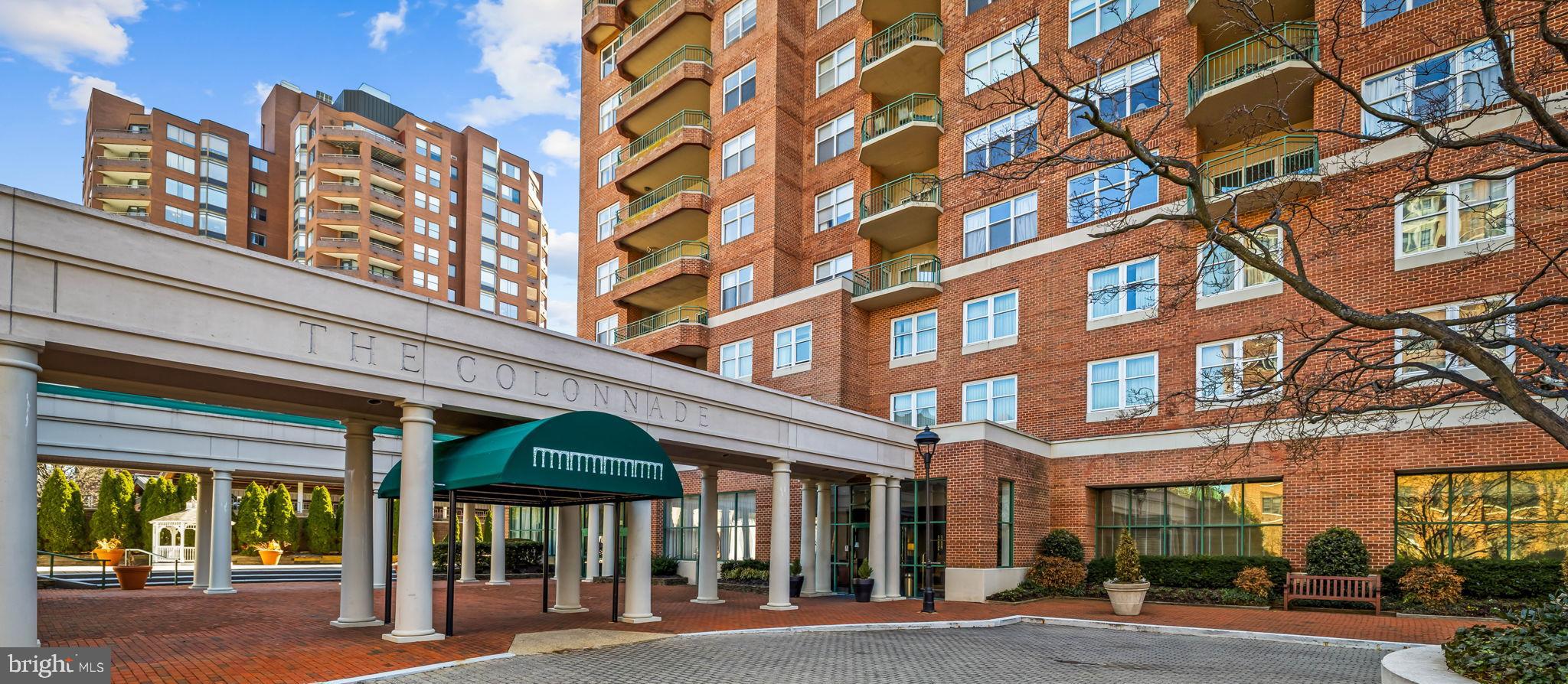 Set atop The Residences at the Colonnade, this rarely available residence has been quietly waiting for its next chapter. Nearly 3,700 square feet of dramatic volume, light, and architectural presence unfold across multiple levels, offering a remarkable opportunity to shape a truly special home in one of Baltimore’s most distinguished buildings.

The first impression is unforgettable. A soaring two-story living room rises nearly 25 feet, anchored by a gas fireplace framed by custom built-in bookcases and crowned by a stunning oversized brass chandelier. Walls of windows frame sweeping views toward Johns Hopkins Homewood Field, while a cleverly tucked-away wet bar sits opposite the fireplace, making the space as functional for entertaining as it is beautiful. A conveniently located powder room sits just off the living area.

The kitchen and adjacent breakfast room overlook the treetops and the university beyond and offer generous workspace along with an indoor grill, a rare feature for year-round cooking. The kitchen works beautifully as it is today, with a footprint that also allows for a future redesign should a new owner wish to personalize it over time.

The home is arranged in two distinct wings, creating both privacy and a wonderful sense of space. One wing is anchored by the primary suite, a private retreat featuring a fireplace, marble bath with soaking tub and separate shower, dressing area, and two exceptionally large walk-in closets. A separate office overlooks the university grounds, and an additional bedroom with its own ensuite bath sits nearby on this side of the home.

The opposite wing includes another bedroom suite with its own bath and walk-in closet, along with an elegant fireside library that could easily serve as an additional bedroom if needed. This wing also includes a private elevator that connects directly to the second level.

Upstairs, an open balcony sitting area overlooks the dramatic living room below, while an expansive recreation room with a full bath offers endless possibilities for a media room, studio, gym, or guest space. The upper level also includes an extraordinary amount of storage, something rarely found in penthouse living.

The home has been well cared for over the years, and a new owner may choose to update or personalize certain spaces over time. With its remarkable scale, architectural details, and commanding views, the opportunity to create something truly special here is undeniable.

Life at the Colonnade includes 24-hour doormen, front desk service, on-site management and maintenance, and a fitness room. The residence also conveys with three deeded parking spaces in the building’s secure garage.

A home defined not only by its size, but by its presence, its views, and the rare opportunity it offers.