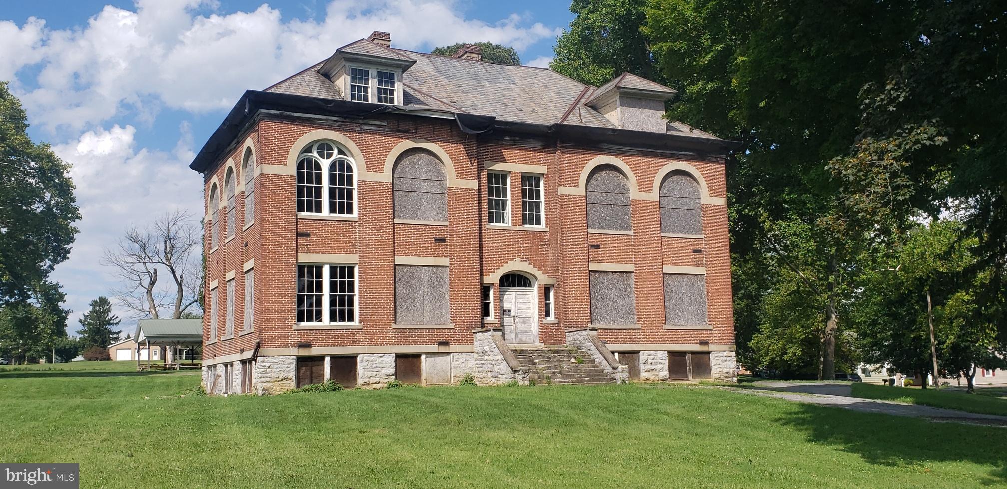 THIS LISTING IS THE FORMER ZULLING SCHOOL. ZONING IS R1, SINGLE FAMILY RESIDENTIAL, All ALL CONTRACTS TO BE IN BY FRIDAY, 8/25 4PM!   
THEREFORE NOT LIST IN COMMERICAL PROPERTIES.  ZONING MAY BE ABLE TO BE CHANGED WITH A REQUEST FOR A ZONING CHANGE BY WASHINGTON TOWNSHIP AS PROPERTY ON CORNER OF WHARF ROUTE AND ROUTE 16 IS COMMERICAL AND TO THE REAR ZONING IS R-2. CONTACT WASHINGTON TOWNSHIP MUNICIPAL OFFICE FOR VERTIFICATION. 
PROPERTY FRONTS ON BUCHANAN TRAIL EAST AND GRACE AVENUE.
BEING SOLD "AS IS". 
VEIWING AT YOUR OWN RISK AND SELLER MUST BE HELD HOLD HARMLESS.
NO POWER!
CHAD REICHARD OF WASHINGTONSHIP ADVISED THAT LAND ADJACENT, ZULLINGER COMMUNITY CENTER IS COMMERCIAL ZONE. LAND TO THE REAR IS R2 MULTI FAMILY.
A CHANGE IN ZONING, MAY BE POSSIBLE, AND WOULD NOT BE SPOT ZONING FOR THE 2 DISTRICTS MENTIONED.