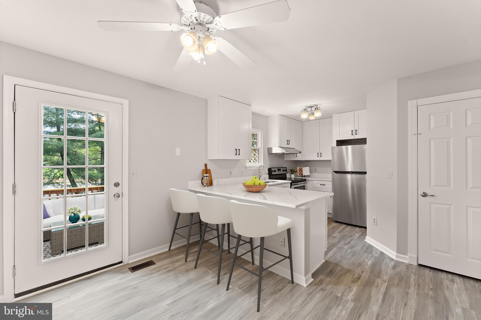 Open house Saturday5/9 from 1-3  Move-in ready and minutes from it all! Located in the sought-after Main Street Village community, this updated townhome in charming Purcellville has been freshly improved inside and out, offering easy everyday living in one of the area’s most convenient and connected locations. The main level features a spacious living and dining room with refinished hardwood floors. You’ll love the beautifully remodeled kitchen, completed in 2025 with quartz countertops, white cabinetry, stainless steel appliances, and opening directly to the back deck for grilling and gatherings. A powder room and coat closet complete this level. Upstairs, the primary bedroom includes a full en suite bath (also updated in 2025), joined by two additional bedrooms and a full hall bath. The lower level offers a fourth bedroom and a full bath, creating a private guest suite, along with a rec room with fireplace and walk-out access to the backyard. You’ll also find laundry and generous storage on this level. Out back, the yard is great for pets and play. Other recent improvements include whole-house paint, new carpets, refinished hardwoods, and a refreshed back deck, all in 2026. The roof is 7 years old, windows 6 years, appliances 4 years, and front deck 3 years. The location is hard to beat. Main Street Station is within walking distance with grocery shopping, dining, salons, and everyday conveniences. Historic downtown Purcellville is just beyond, offering a charming library, boutiques, local restaurants, and direct access to the Washington & Old Dominion Trail for biking and walking. Nearby Franklin Park spans over 200 acres with Blue Ridge views, hiking, fishing, and a performing arts center known as one of Loudoun’s top cultural venues. Route 7 is minutes away for commuting east to the Dulles Greenway and Dulles International Airport, and Loudoun County’s celebrated wine, brewery, and farm country is right at your doorstep. Well-located and thoughtfully improved, this is a home you can simply move into and enjoy!