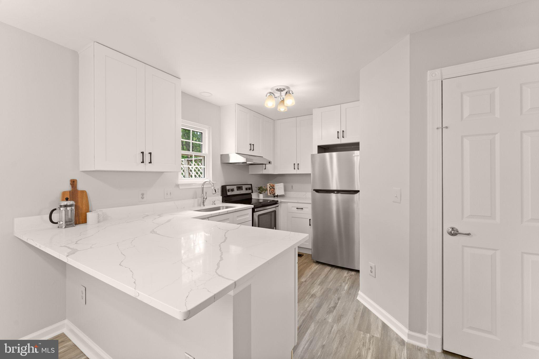 Open house Saturday5/9 from 1-3  Move-in ready and minutes from it all! Located in the sought-after Main Street Village community, this updated townhome in charming Purcellville has been freshly improved inside and out, offering easy everyday living in one of the area’s most convenient and connected locations. The main level features a spacious living and dining room with refinished hardwood floors. You’ll love the beautifully remodeled kitchen, completed in 2025 with quartz countertops, white cabinetry, stainless steel appliances, and opening directly to the back deck for grilling and gatherings. A powder room and coat closet complete this level. Upstairs, the primary bedroom includes a full en suite bath (also updated in 2025), joined by two additional bedrooms and a full hall bath. The lower level offers a fourth bedroom and a full bath, creating a private guest suite, along with a rec room with fireplace and walk-out access to the backyard. You’ll also find laundry and generous storage on this level. Out back, the yard is great for pets and play. Other recent improvements include whole-house paint, new carpets, refinished hardwoods, and a refreshed back deck, all in 2026. The roof is 7 years old, windows 6 years, appliances 4 years, and front deck 3 years. The location is hard to beat. Main Street Station is within walking distance with grocery shopping, dining, salons, and everyday conveniences. Historic downtown Purcellville is just beyond, offering a charming library, boutiques, local restaurants, and direct access to the Washington & Old Dominion Trail for biking and walking. Nearby Franklin Park spans over 200 acres with Blue Ridge views, hiking, fishing, and a performing arts center known as one of Loudoun’s top cultural venues. Route 7 is minutes away for commuting east to the Dulles Greenway and Dulles International Airport, and Loudoun County’s celebrated wine, brewery, and farm country is right at your doorstep. Well-located and thoughtfully improved, this is a home you can simply move into and enjoy!