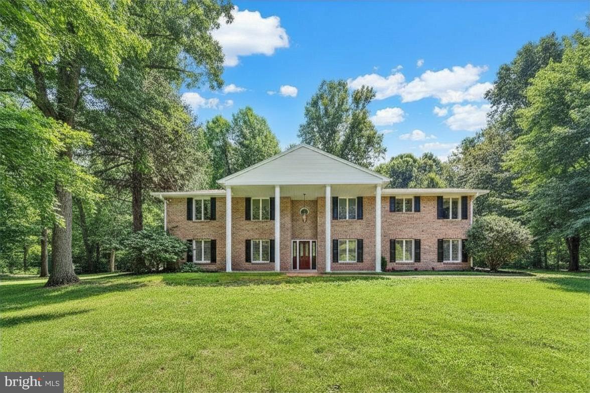 You must see this beautiful and spacious all brick home, located back a long private driveway in Governor Mifflin School District on a 1.82 acre lot!  Upstairs you will find new wood flooring and fresh paint throughout, as well as a large eat-in kitchen with custom cherry cabinets, built-in appliances, and new quartz countertops! The kitchen flows nicely into the formal dining and living rooms. You will also find a family room/den with an impressive stone wood-burning fireplace and sliding glass doors to the backyard. And to complete this level, there are 3 bedrooms and 3 full bathrooms including the master bedroom suite which boasts glass doors leading out to the back deck. You will also fall in love with the outside! The backyard is completely private with a gorgeous wooded backdrop plenty of space for entertaining or play. There is also a 2-car side entry garage and an additional drive area along the top of the property for plenty of parking or to access the main level. Downstairs there is a huge storage space on the lower level that could easily be finished to add more living space -  such as a kitchenette - for true multi-generational living. Other notable features include: a main floor laundry, newer roof (2015), newer central HVAC (2020), 2 new split units added downstairs (2024), newly remodeled bathrooms (2025), 4th full bathroom added downstairs (2023), newer hot water heater (2021), new insulation in attic (2024), updated lighting (2024), and newly installed back deck (2025). And, to top it off, a one-year Cinch home warranty is included for your peace of mind!