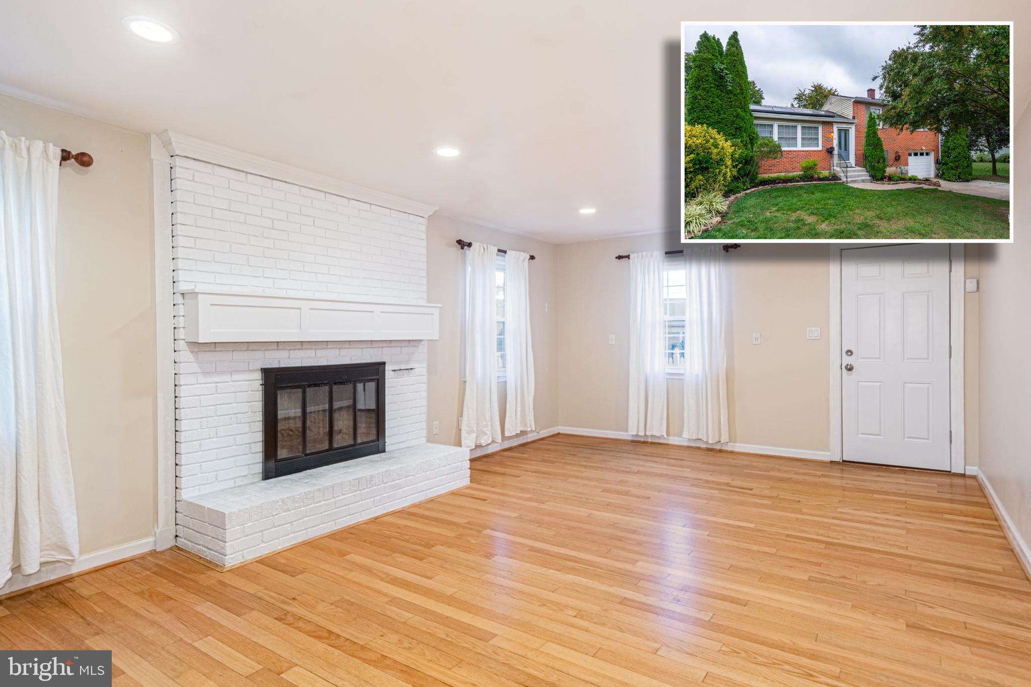 BEAUTIFUL AND BRIGHT SPLIT LEVEL HOME IN DESIRABLE LOCATION WITH OVER 1,800 SQ. FT. OF LIVING SPACE!  Features include gleaming hardwood floors throughout, an inviting living room with crown molding, a spacious eat-in kitchen with a breakfast area with built-in desk, ample cabinet space, and Quartz counters, upper level with 3 generously sized bedrooms with a hall bath, finished lower level with a large family room with a wood burning fireplace, workshop that can be finished to add more living space, a half bath, and laundry room, a rear screened in porch overlooking the large fenced yard with a storage shed which is perfect for entertaining, a 1 car garage with 2 additional driveway parking spaces with an electric  car charger and solar panels to keep utility bills low.  The location can't be beat - minutes to tons of shopping and restaurants and convenient to major roadways.  Solar panels are owned so there is no lease for the new buyer to assume.  Pack your bags and move right in!