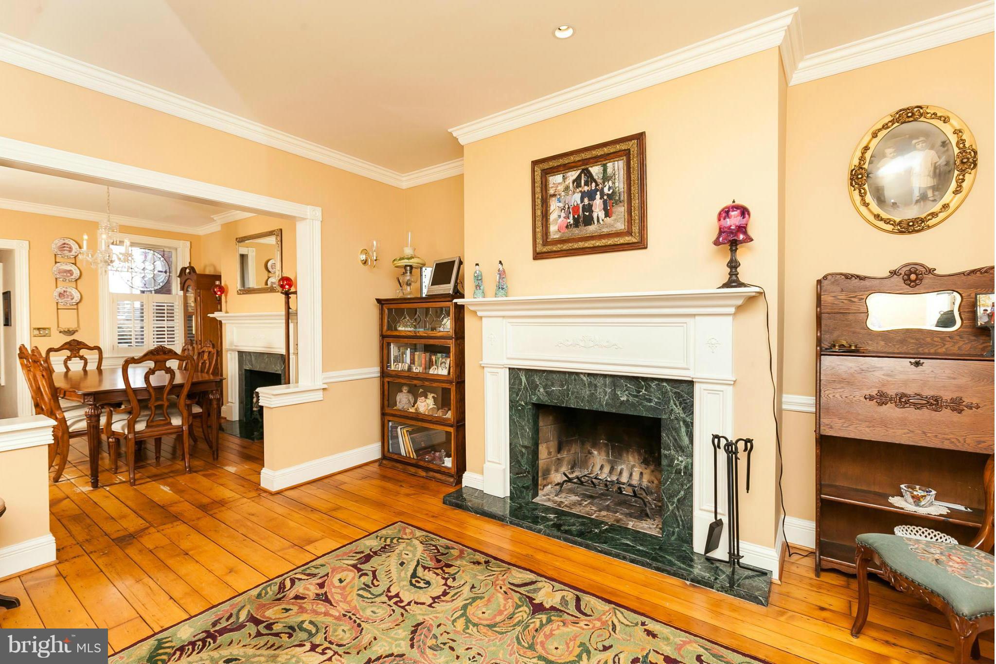 Everything you'd expect, and more, of a Federal Hill period style ths.. Carefully renovated to marry traditional style w modern amenities.Wide plank hrdwds, chair rails, wainscoting, plantation shutters, beautiful mantels, 2 wrkg FP, meticulous moldings. Classic white kit remodel (elec stove easily replaced w gas) Lower level w xposed brk & beams, wet bar, full ba. Perfect teen/housemate space.