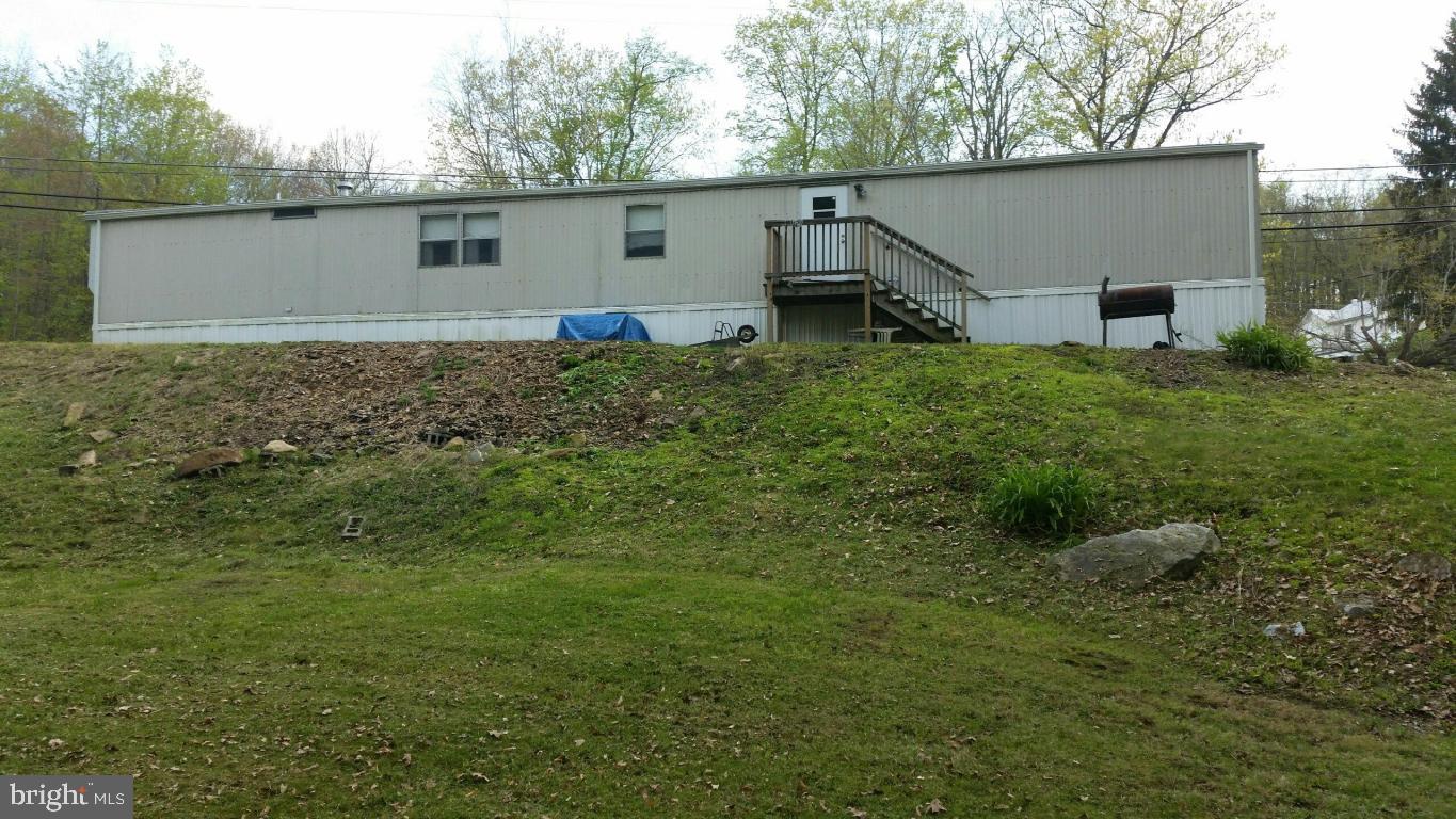 Raystown Lake!  Nice, furnished mobile w/ public utilities on 2.75 acres w/ a stream.  Minutes to Raystown Lake.  Make this your hunting or fishing camp!