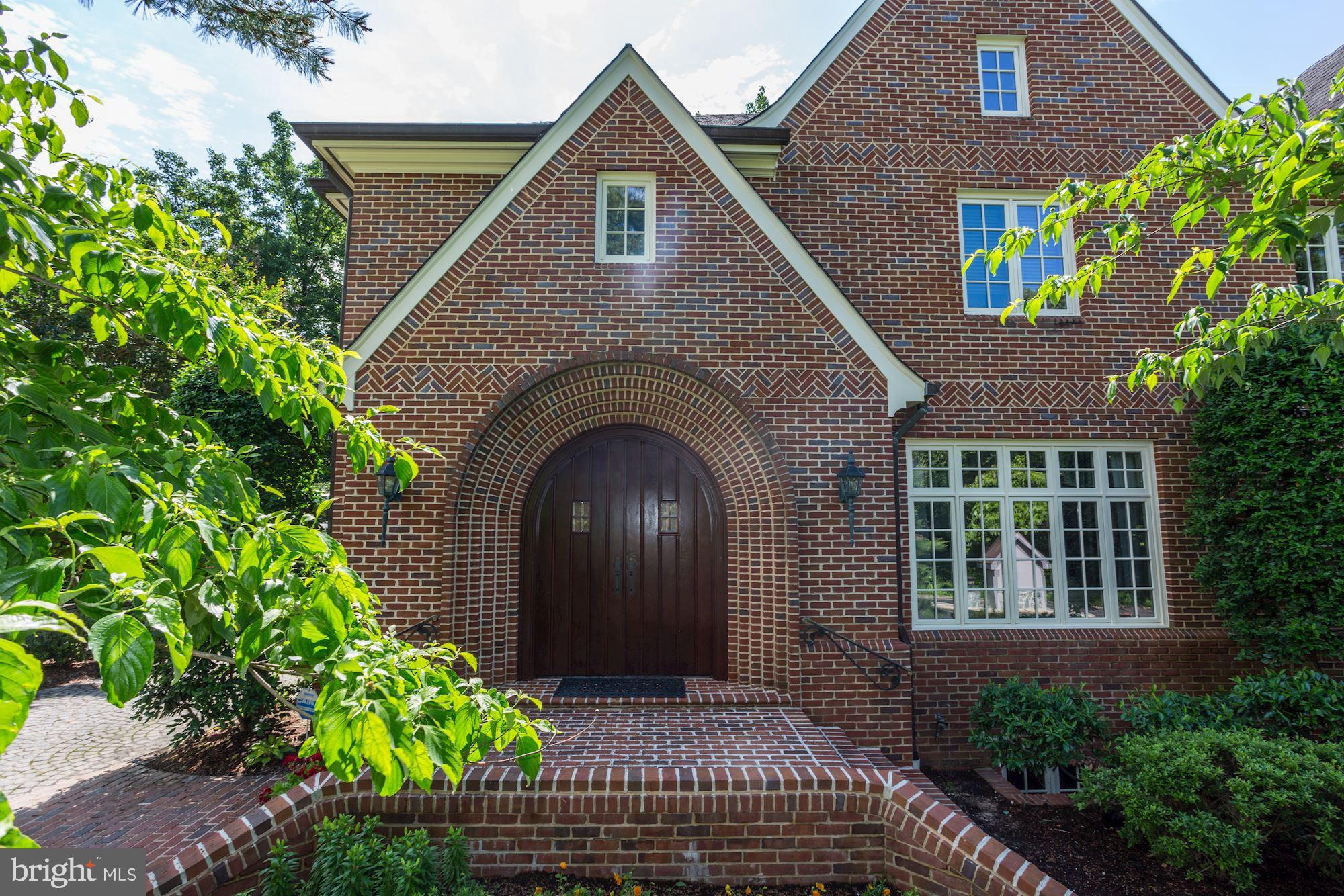PRICE ALERT!! Custom built all brick home in North Arlington featuring over 6700 SF of wonderful living space on 3 finished levels.  Features include 5 bedrooms, 4.5 bathrooms, arched brick entry with double Mahogany front door, spacious foyer with imported English Limestone Flooring.  Just 1 light to DC and backing to over 37 acres of county park land! Beautifully detailed moldings, mahogany billiard room, hand laid brick flooring, reclaimed wood beams from Mississippi River, Walnut master bath, Kitchen with breakfast room & family room open to deck & fenced yard. Walk to Nature Center Potomac River, tennis and basketball court.