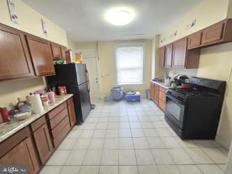 This property is currently occupied and the tenant needs 24hr notices for all showings please. This is a wonder property to add to your portfolio or if your the first time investor looking for a property with instant income well here you are. This 3 bedroom 1 bathroom middle of group row home is currently rented out for $1,600 a month. The tenant is responsible for all utilities including water. The property has a current rental license and lead certificate. The property features Stove, Refrigerator, Central Air and Washer and Dryer Ceiling fans in each bedroom. The basement is currently unfinished but has the height needed to be completed if your looking to add value and extra square footage of living space. The tenant has been in the property since April of 2025 and is looking to stay if the new owner is ok with that. Please contact the listing agent to schedule all showings.