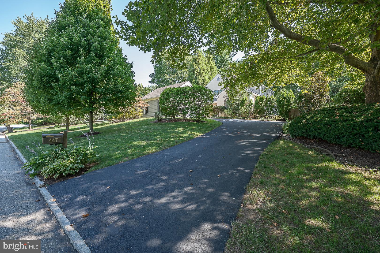 A FIRST FLOOR PRIMARY BEDROOM SUITE  is finally available. Welcome to this exceptional home in the highly coveted Inveraray neighborhood of Radnor Township, where luxury and tranquility blend seamlessly. Surrounded by scenic open space, this residence offers a perfect combination of sophisticated design and modern comforts.
Step into the grand 2-story foyer, where sunlight streams through a clerestory window, illuminating the beautiful millwork and wainscoting throughout. The living room features a wall of windows that invite serene outdoor views inside, while the adjacent dining room showcases a triple window overlooking a peaceful koi pond—an ideal setting for intimate gatherings.
The gourmet kitchen is a chef’s dream, complete with a center island, updated high end appliances including a 6-burner gas cooktop, Miele range, wine fridge, and two additional refrigerator drawers. A large pantry/coffee bar with a sink adds to the kitchen’s functionality. The kitchen flows effortlessly into a skylit family room, where a gas fireplace is flanked by custom built-in bookshelves and an additional corner cabinet.
On the main level, the desirable 1st-floor primary bedroom serves as a private retreat, featuring a large inset triple window that brings the outdoors into this serene space. The ensuite spa-like bathroom offers two vanity sinks, a closet with floor-to-ceiling mirrored doors, and a separate room with a dual shower and soaking tub, providing a true sanctuary.
Convenience continues with the laundry/mudroom, which provides direct access to the attached garage and an additional door leading outside. A Guest Powder Room completes the first floor. The large finished lower level is designed for entertainment and leisure, complete with an exercise room, full bath, game area with built-in shelving for a TV, and a wet bar—perfect for hosting friends and family.
The second floor offers even more versatility, with two nicely sized bedrooms connected by an updated Jack and Jill bath. Additionally, a private bath and a flex space on this floor can serve as an office, storage area, or an extra bedroom—adapting to your needs as they change.
Outside, the 2-tiered patio is perfect for outdoor dining or relaxing under the retractable awning, while the nearby koi pond and fountain create a soothing ambiance.
Don’t miss your chance to own this remarkable home in one of Radnor Township’s most desirable communities. Schedule your private showing today to experience luxury living at its finest.