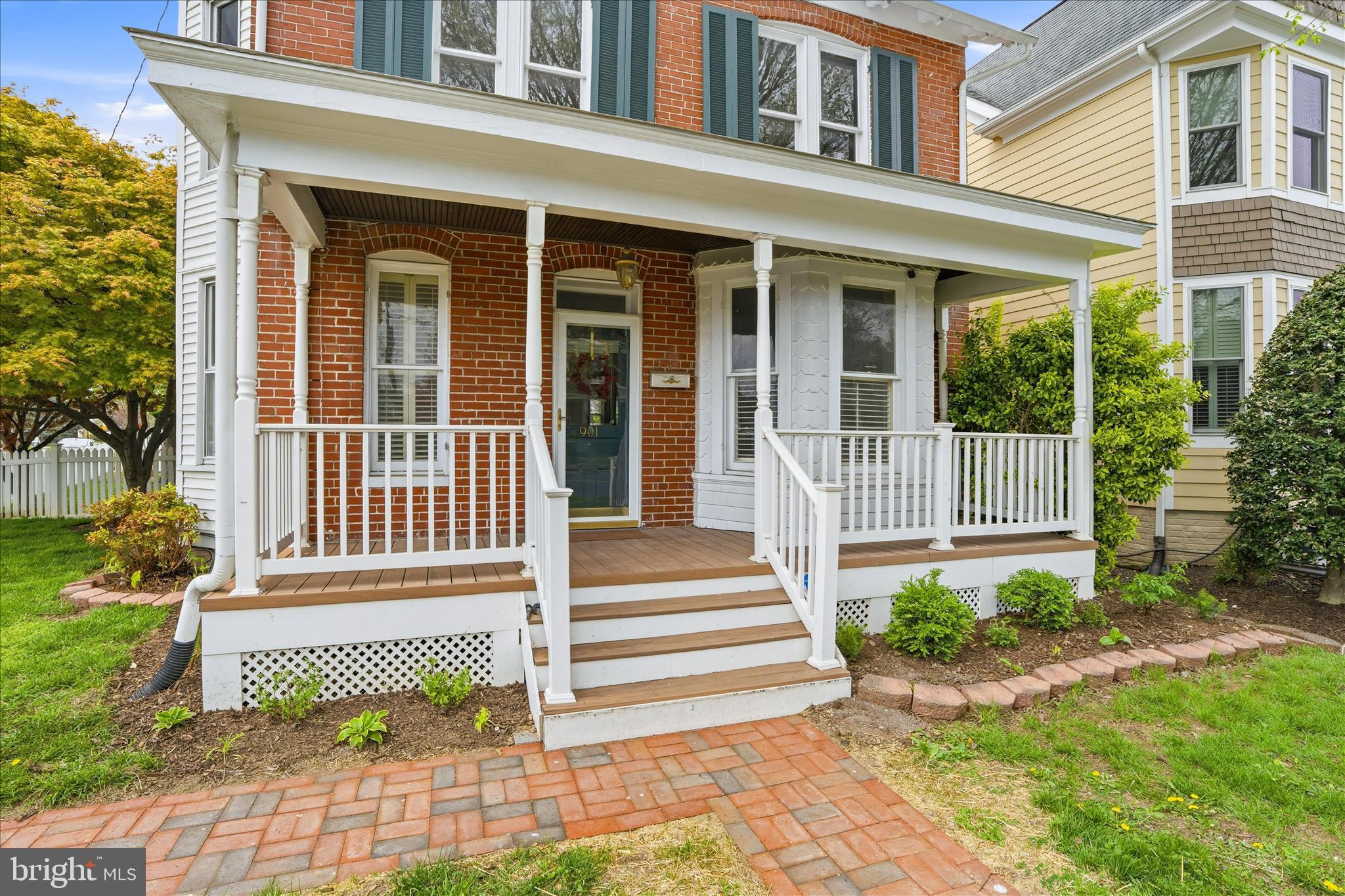 Listing Refresh!! - HUGE PRICE IMPROVEMENT.  House is now staged.  New Photos Coming this week!  901 N Market Street is the kind of place that makes people stop and say "Wait. . .  this is downtown?"  A beautiful brick historic home (just outside the historic district) with original hardwood floors, high ceilings, gas furnace installed in 2015, new CAC in 2025, remodeled first floor bathroom in 2025, and replacement roof in 2017.  The home provides plenty of natural light and move-in ready, functional layout supported by features of the 1900's.  When stepping outside, you're surrounded by lush, intentional landscaping that feels more like a private garden than a city lot.  Mature plantings, layered greenery, and a fully fenced yard (fence 2020) creates a peaceful retreat and perfect hangout spot.  Whether its weekend cookouts, evening drinks, or just letting the dog run free, this backyard delivers a level of privacy and calm you almost never find in downtown Frederick.  And then there's the front porch for morning coffee, late-night conversations, waving and connecting with neighbors passing by.  This historic home delivers the 1900's charm and modern conveniences yet just a short walk to everything downtown Frederick has to offer and less than two blocks from the Frederick YMCA and Staley Park, in addition to walking distance to all three level schools.   This location cannot be beat!  It's rare. Its unexpected.  And it's the kind of property people remember.