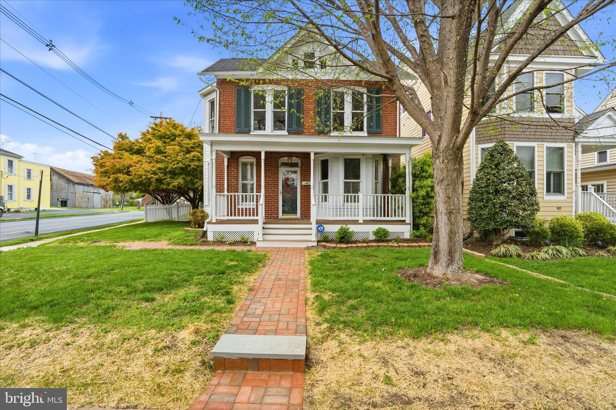 **$10,000 SELLER CREDIT for ratified contract by June 3rd!!** 901 N Market Street is the kind of place that makes people stop and say "Wait. . .  this is downtown?"  A beautiful brick historic home (just outside the historic district) with original hardwood floors, high ceilings, gas furnace installed in 2015, new CAC in 2025, remodeled first floor bathroom in 2025, and replacement roof in 2017.  The home provides plenty of natural light and move-in ready, functional layout supported by features of the 1900's.  When stepping outside, you're surrounded by lush, intentional landscaping that feels more like a private garden than a city lot.  Mature plantings, layered greenery, and a fully fenced yard (fence 2020) creates a peaceful retreat and perfect hangout spot.  Whether its weekend cookouts, evening drinks, or just letting the dog run free, this backyard delivers a level of privacy and calm you almost never find in downtown Frederick.  And then there's the front porch for morning coffee, late-night conversations, waving and connecting with neighbors passing by.  This historic home delivers the 1900's charm and modern conveniences yet just a short walk to everything downtown Frederick has to offer and less than two blocks from the Frederick YMCA and Staley Park, in addition to walking distance to all three level schools.   This location cannot be beat!  It's rare. Its unexpected.  And it's the kind of property people remember.