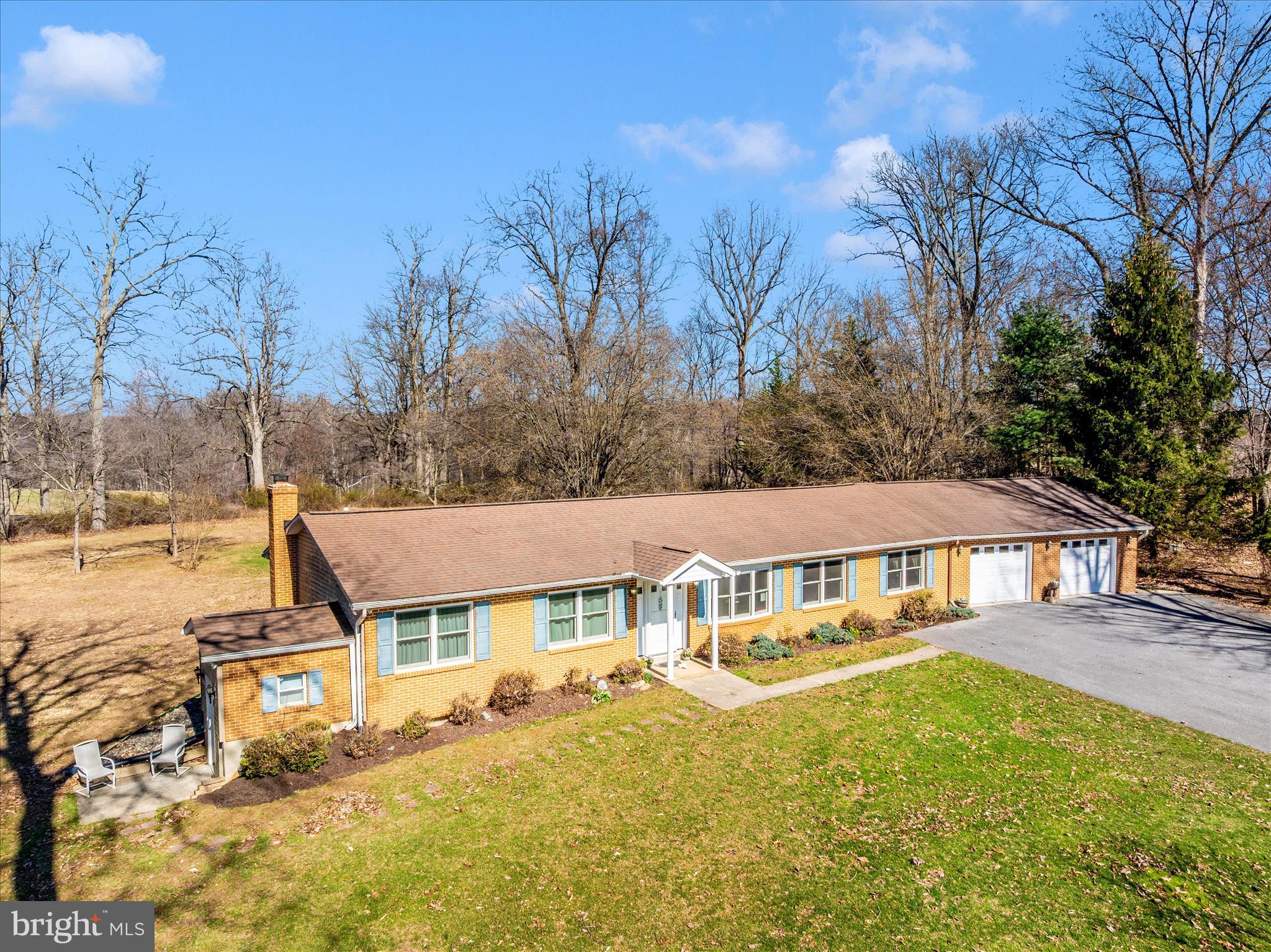 OPEN House Canceled - Under contract! Rare opportunity to own a charming rancher in the highly sought-after Urbana School District, tucked away on a quiet cul-de-sac and set on 2 acres of peaceful, private living. This home offers true main-level living with 3 bedrooms and 2 full baths upstairs, plus a fully finished lower level featuring a spacious in-law suite with kitchenette, additional full bath, and abundant storage. NO HOA!! 

The updated kitchen (2013) is the heart of the home, showcasing Silestone countertops, porcelain tile flooring, stainless steel appliances, updated cabinetry, electric range, and a large island with pendant lighting. A bright breakfast nook has sliding glass and screen door that opens to the rear patio, perfect for enjoying the tranquil wooded backdrop. The home backs to woods with no future development behind—offering exceptional privacy, with seasonal blooms of wild roses and raspberries.

Interior highlights include hardwood flooring throughout the living room, dining room, hall, and bedrooms, recessed lighting, ceiling fans, main-level laundry, and a flexible den/family room or study. The primary suite features a walk-in shower with bench, updated vanity, soft-close cabinetry, and a custom closet system. The hall bath has been updated with new flooring, vanity, mirror, and modern lighting options including a defogger.

The lower level includes a walk-up exit, dry sink/laundry hookup, and generous storage space. The oversized 28x28 garage easily fits three cars and includes electric service, additional attic access with hoist lift system, and extra storage. The extended driveway provides ample parking.

Major updates include Andersen triple-pane tilt-out windows (2017), architectural shingle roof (2013), HVAC system (2013, 16 SEER heat pump/furnace), hot water heater (2023), sump pump ( 5 years), and well pump ( 2008). Additional features include extra attic insulation, three sheds,  electric run to shed/workshop area, and mature landscaping with crepe myrtle, dogwood, hostas, ferns, and japanese maple.

Enjoy scenic views of Sugarloaf Mountain from the welcoming front porch, making this home a rare blend of comfort, privacy, and convenience. Conveniently located - close to major highways, Clarksburg Village Center, Urbana Market District, Urbana Library & shopping and restaurants!
