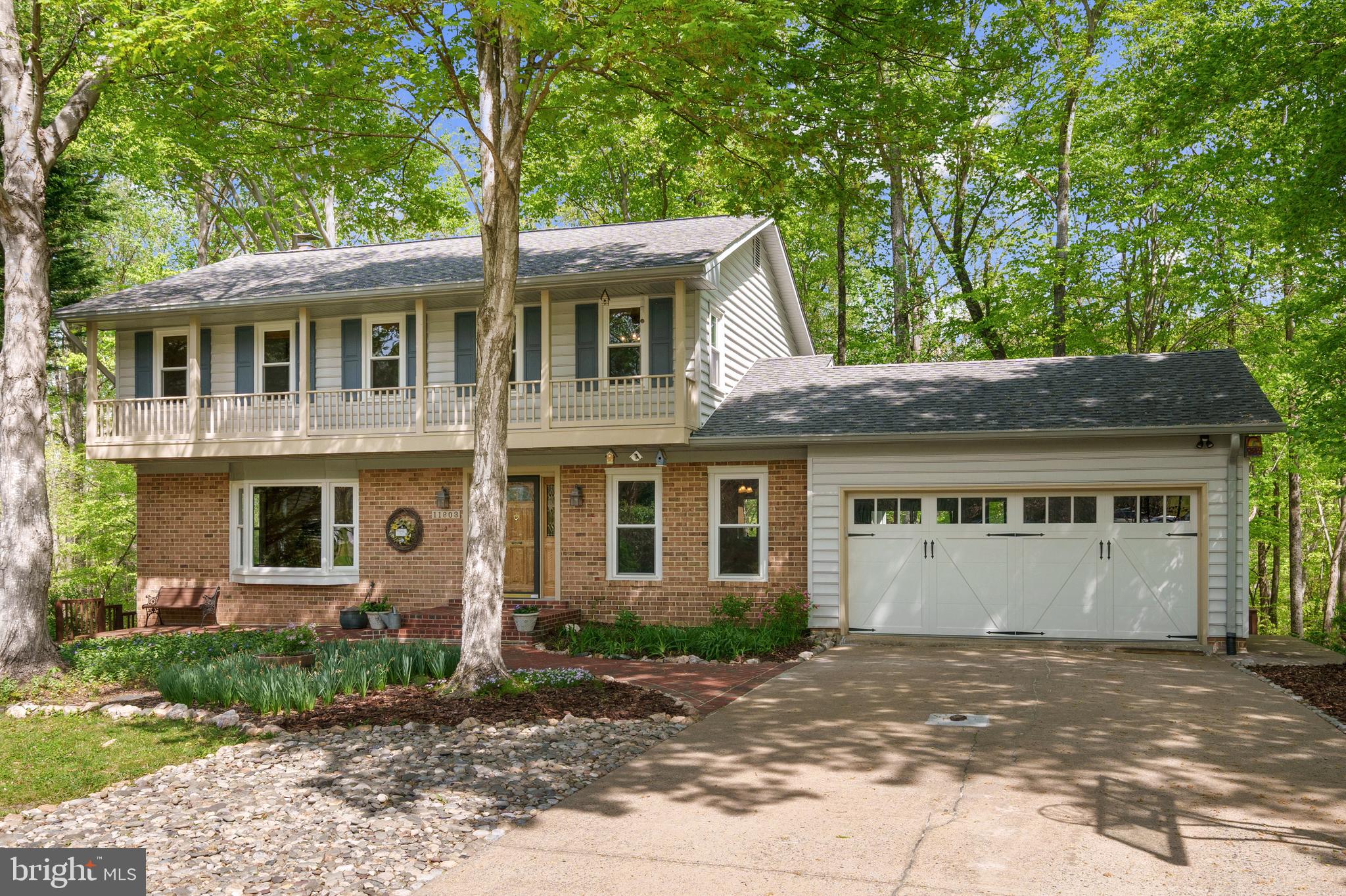 Nestled at the end of a quiet cul-de-sac, this beautifully maintained 4,200-square-foot, 5-bedroom, 3.5-bath home offers a rare combination of privacy, space, and breathtaking water views. Situated on a serene half-acre lot backing directly to the Occoquan River Reservoir, this home is a nature lover's dream with direct water access only a few steps away—launch your kayak or canoe just down the path from your backyard and even stay entertained watching the exciting  local crew teams races across the water! Enjoy spectacular winter water views and beautiful mature trees all summer long from the massive main level addition or expansive covered double decks, perfect for morning coffee or evening gatherings, rain or shine!  

Boasting three spacious levels—entirely carpet free—this home is designed for both relaxation and entertaining. The  open floorplan main level features two separate living areas, two dining spaces, a cozy fireplace, and an open kitchen that makes hosting effortless. There’s also a versatile home office/library with built-in shelving, offering a quiet retreat for work or reading, plus a convenient garage entry and powder room.

Upstairs you'll find 4 bedrooms including a spacious primary suite complete with a jetted jacuzzi tub. 
The lower level includes a spacious rec room, laundry and storage, the home’s 5th bedroom and 3rd full bathroom—ideal for guests, in-laws, or an au pair setup. Additional highlights include a two-car garage, an oversized driveway, and a roof that was replaced in 2016. 

Located in the sought-after Lake Ridge community, residents enjoy an incredible array of amenities, including five pools, a spray ground, two community centers, six tennis courts, 14 basketball courts, four pickleball courts, a volleyball pit, a multi-use court, a boat ramp, 19 playgrounds, two outdoor fitness stations, and scenic hiking/walking trails. With convenient access to major commuter routes and transportation options nearby, this home offers the perfect balance of tranquility and accessibility.

Don’t miss this rare opportunity to own a waterfront oasis in the heart of Lake Ridge!
