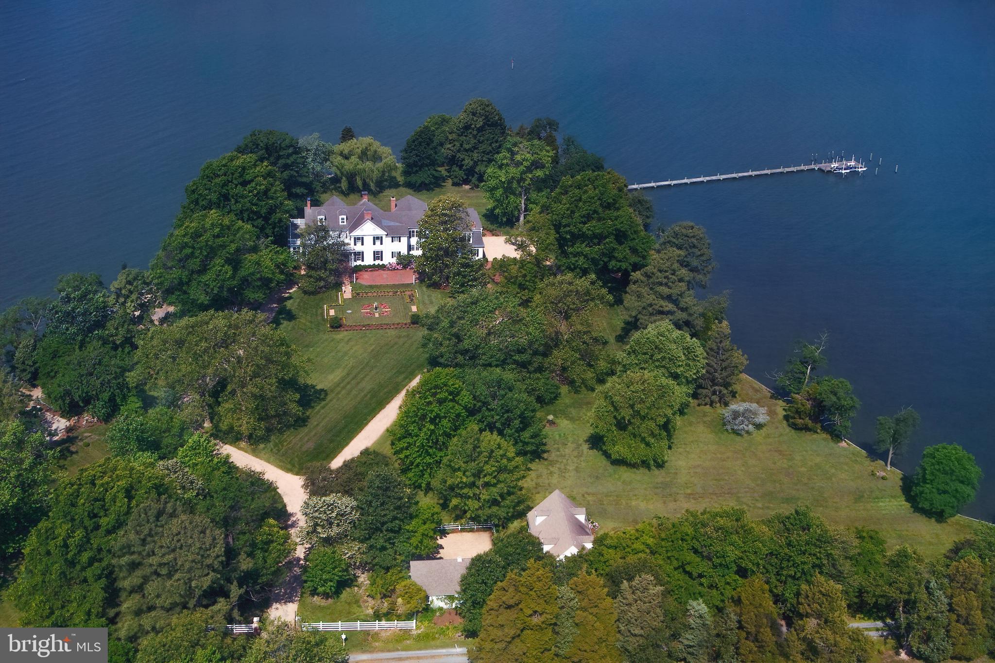 Stunning waterfront offering on Hopkins point with 270 degree views of San Domingo Creek just minutes from downtown St. Michaels and Easton.  Consisting of two lots totaling approximately 10 acres, this historic residence has been lovingly renovated and expanded by the current owner in 2009.  Guest house with additional garage, over 1000' of waterfrontage, and 100' deepwater dock make this a truly special offering.